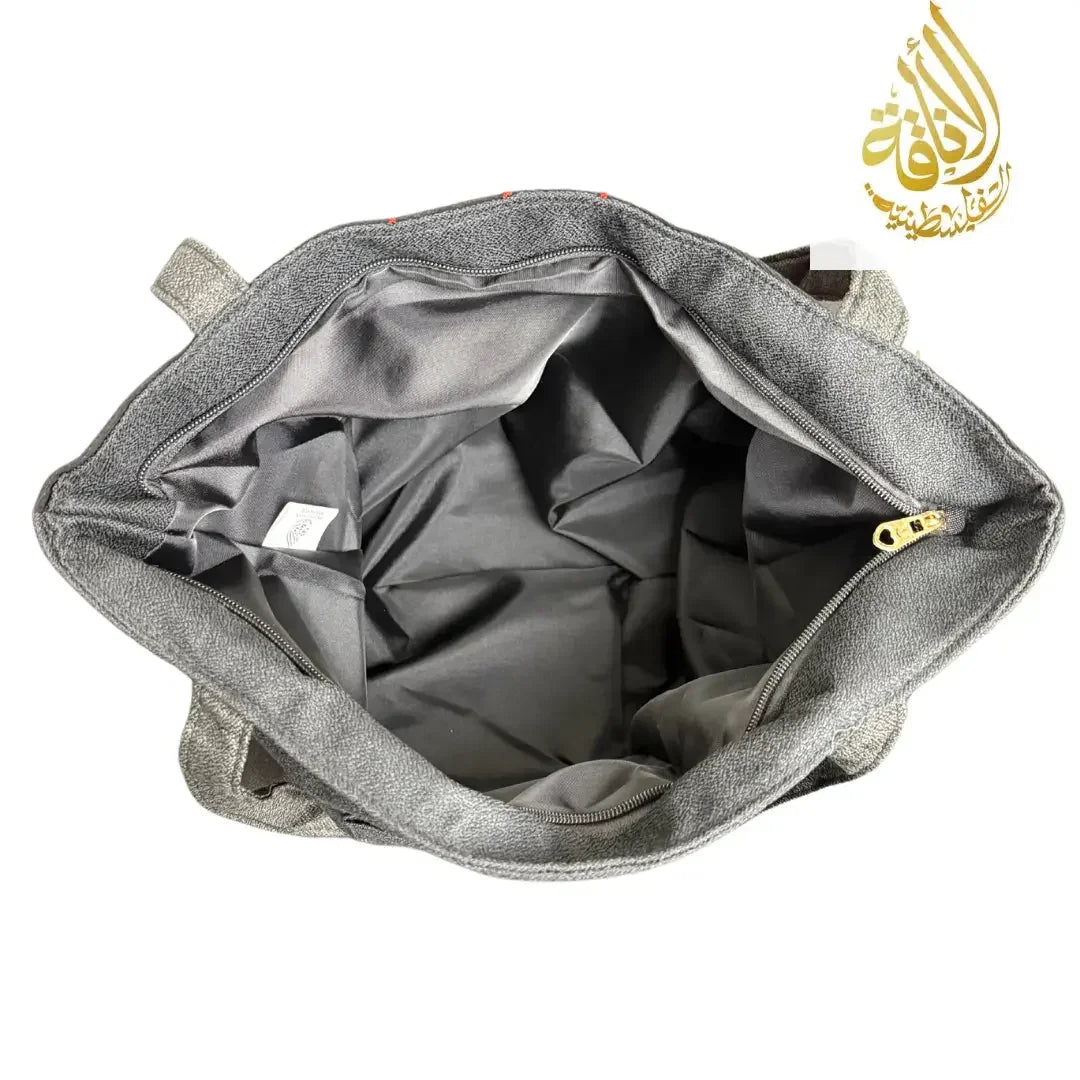 Interior view of gray Palestinian tote bag showing spacious compartments and zippered pocket