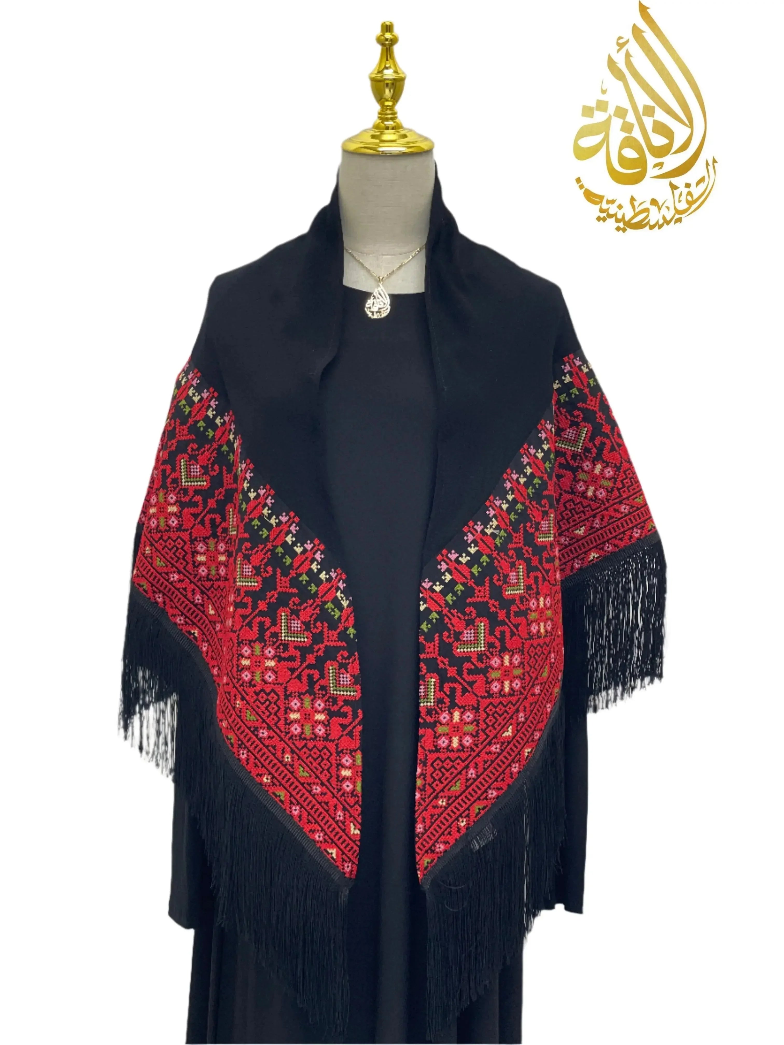 Palestinian embroidered shawl with vibrant red and black traditional patterns and fringe detail