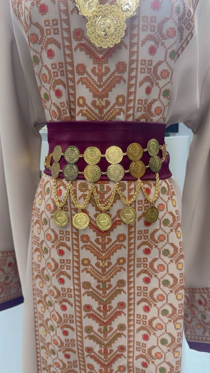 Palestinian Gold Coin-Adorned Zunnar Belt by Palestinian Elegance on traditional embroidered dress