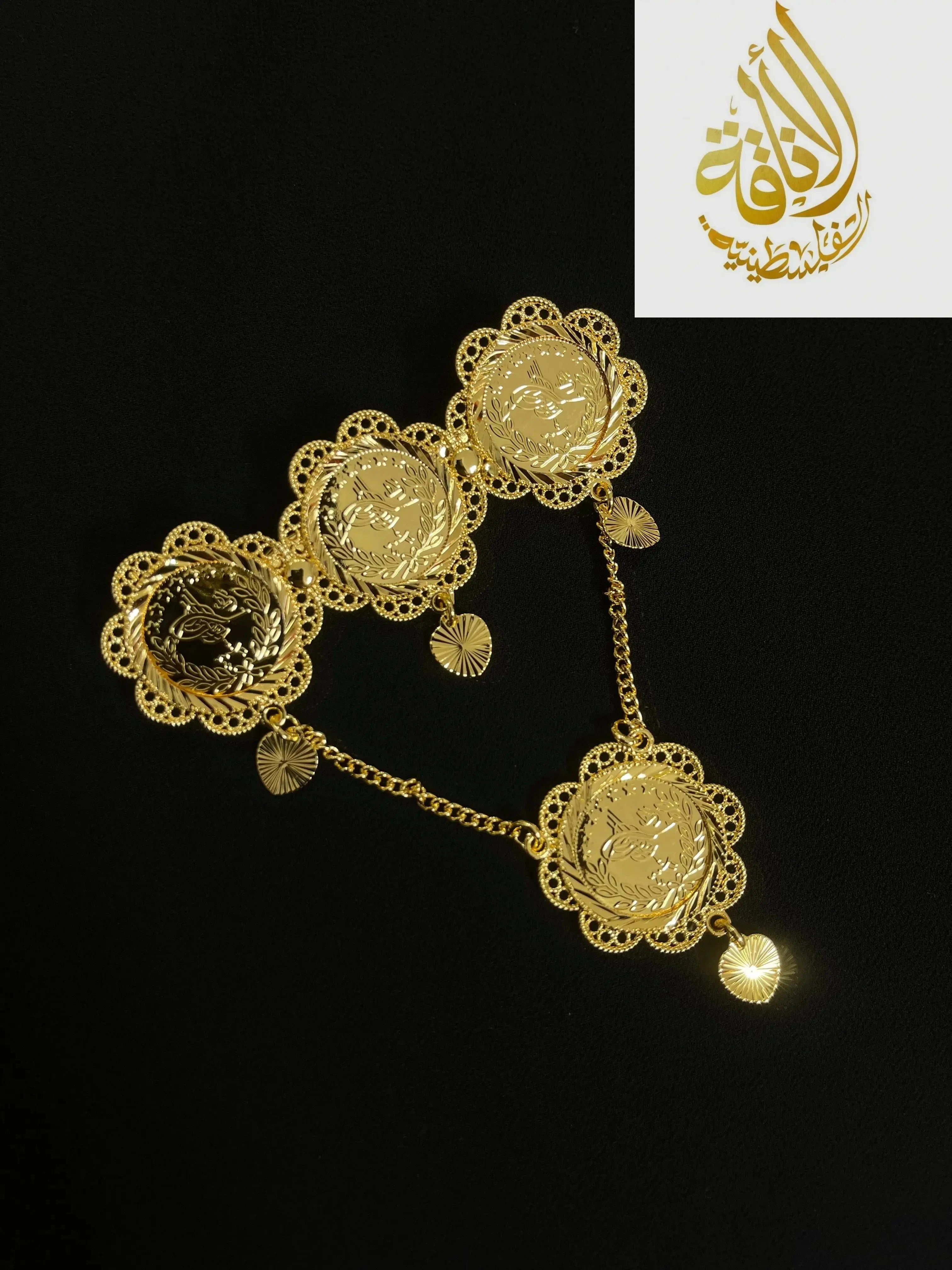 Palestinian gold pin jewelry with intricate floral design and connecting gold chains from Palestinian Elegance