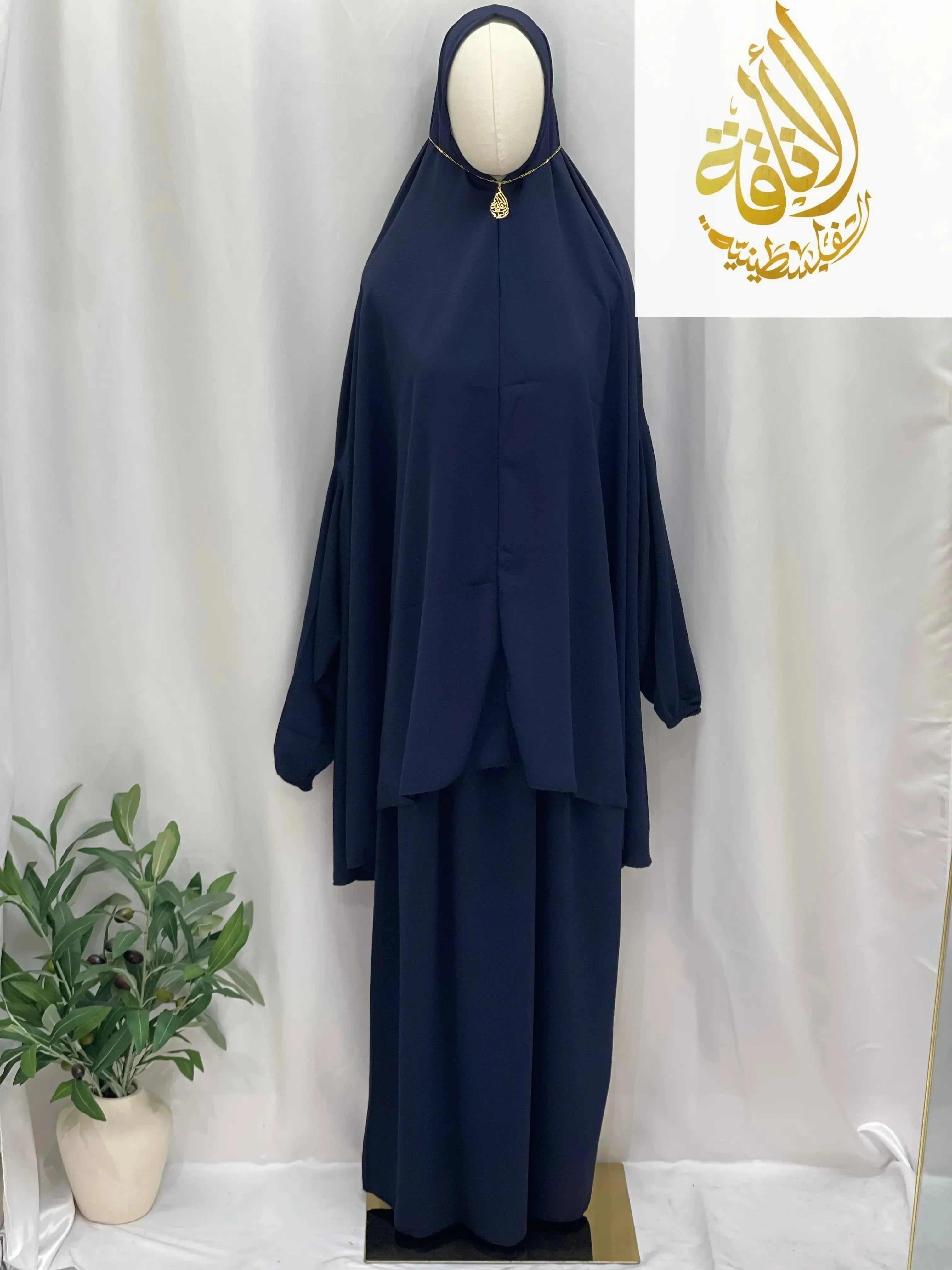 Palestinian Elegance navy blue two piece prayer outfit with loose fit and gold embellishment on hood