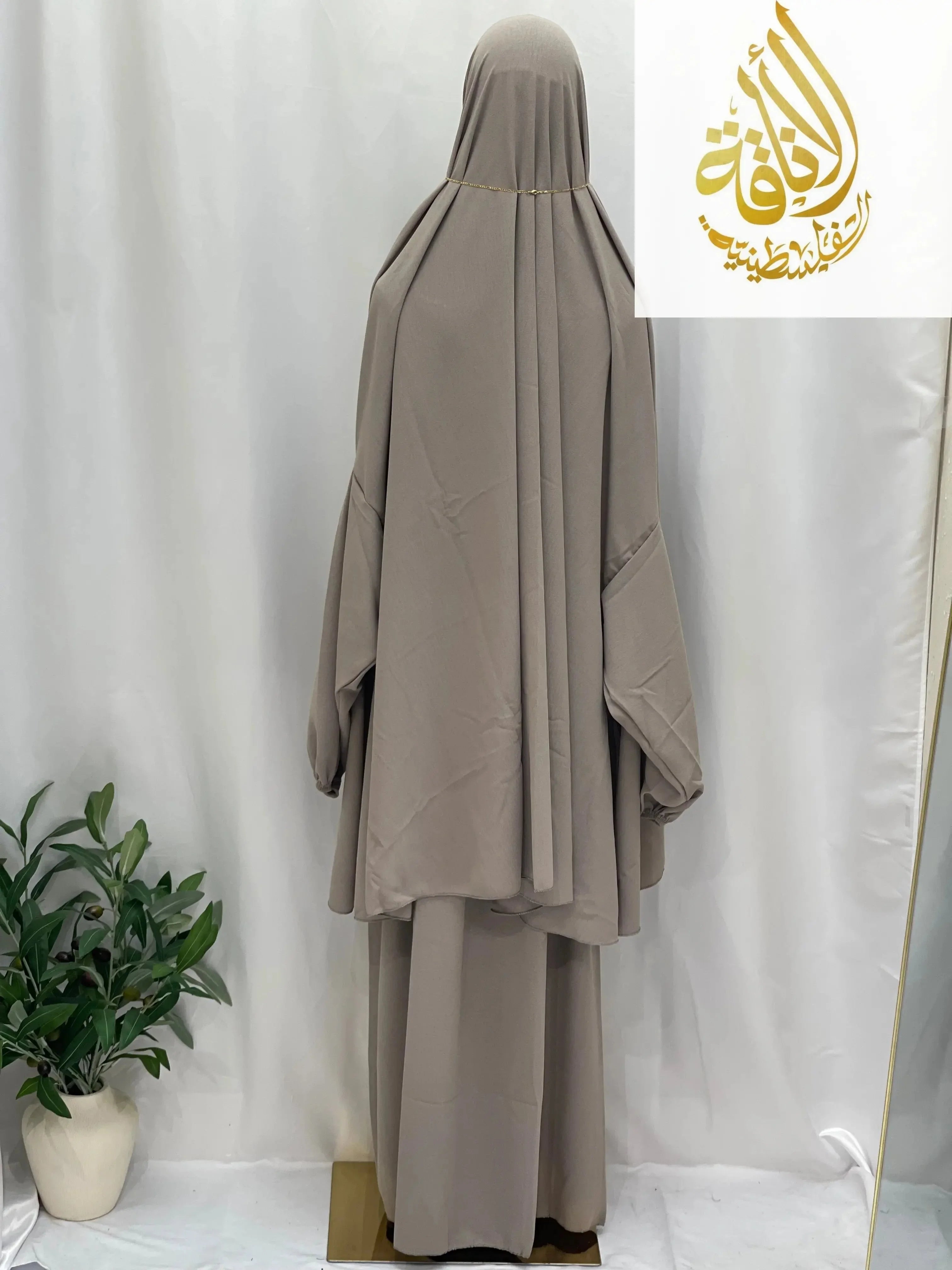 Palestinian Elegance taupe modest two piece prayer outfit displayed on mannequin against white backdrop