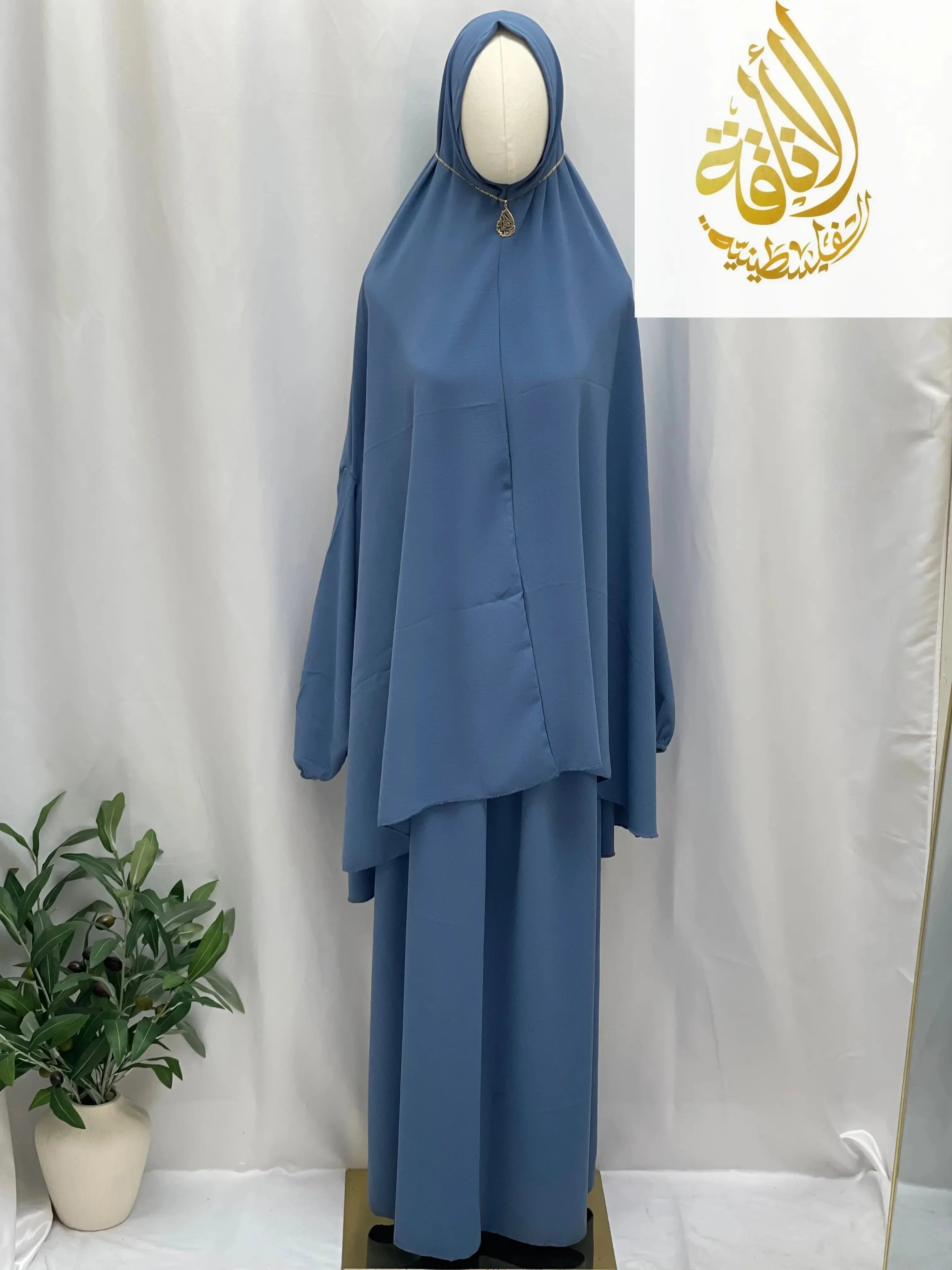 Palestinian Elegance two piece prayer outfit in blue with loose fit and modest design for special occasions