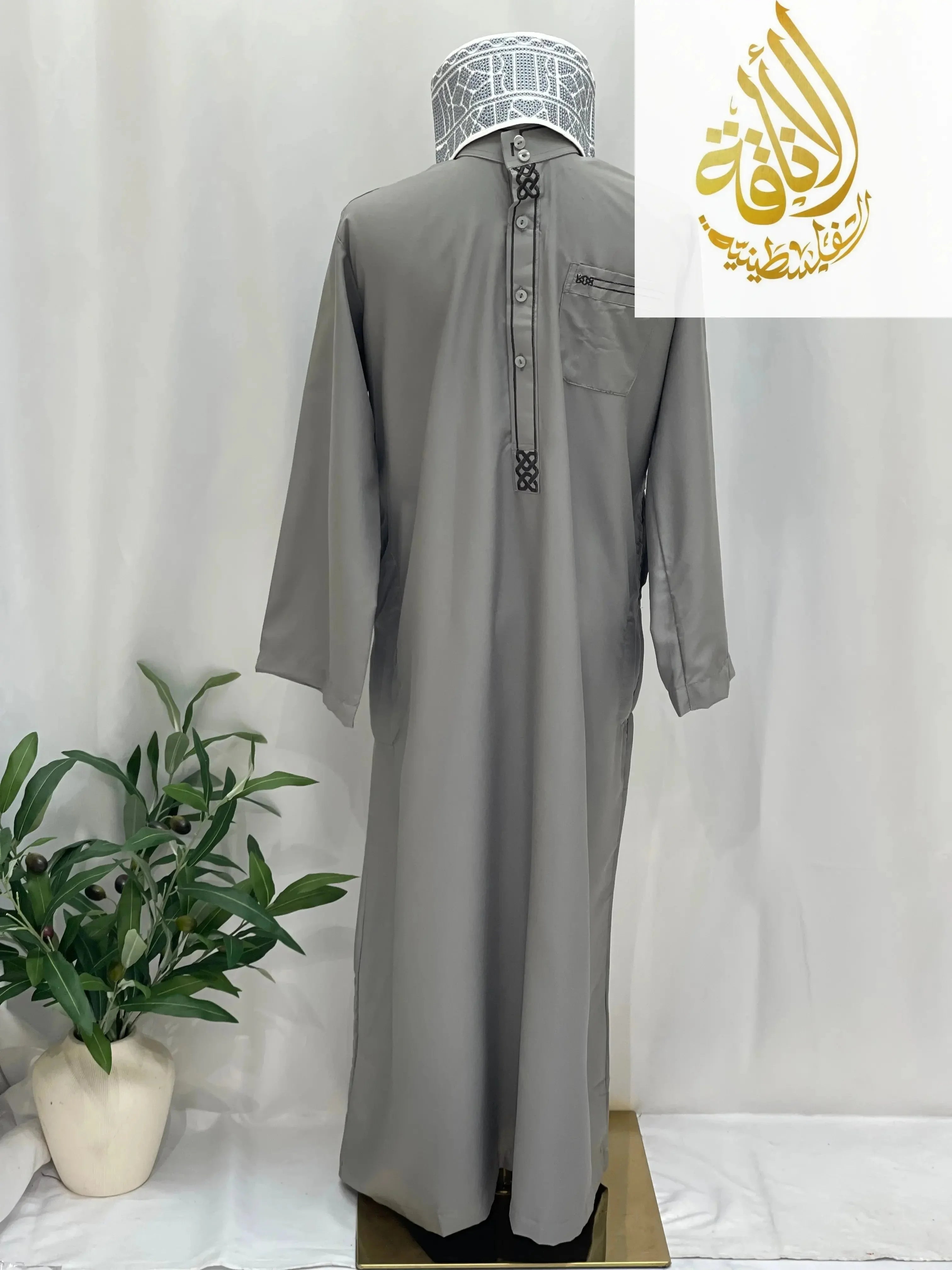 Men thobe by Palestinian Elegance in gray with traditional embroidery details on buttons and chest pocket