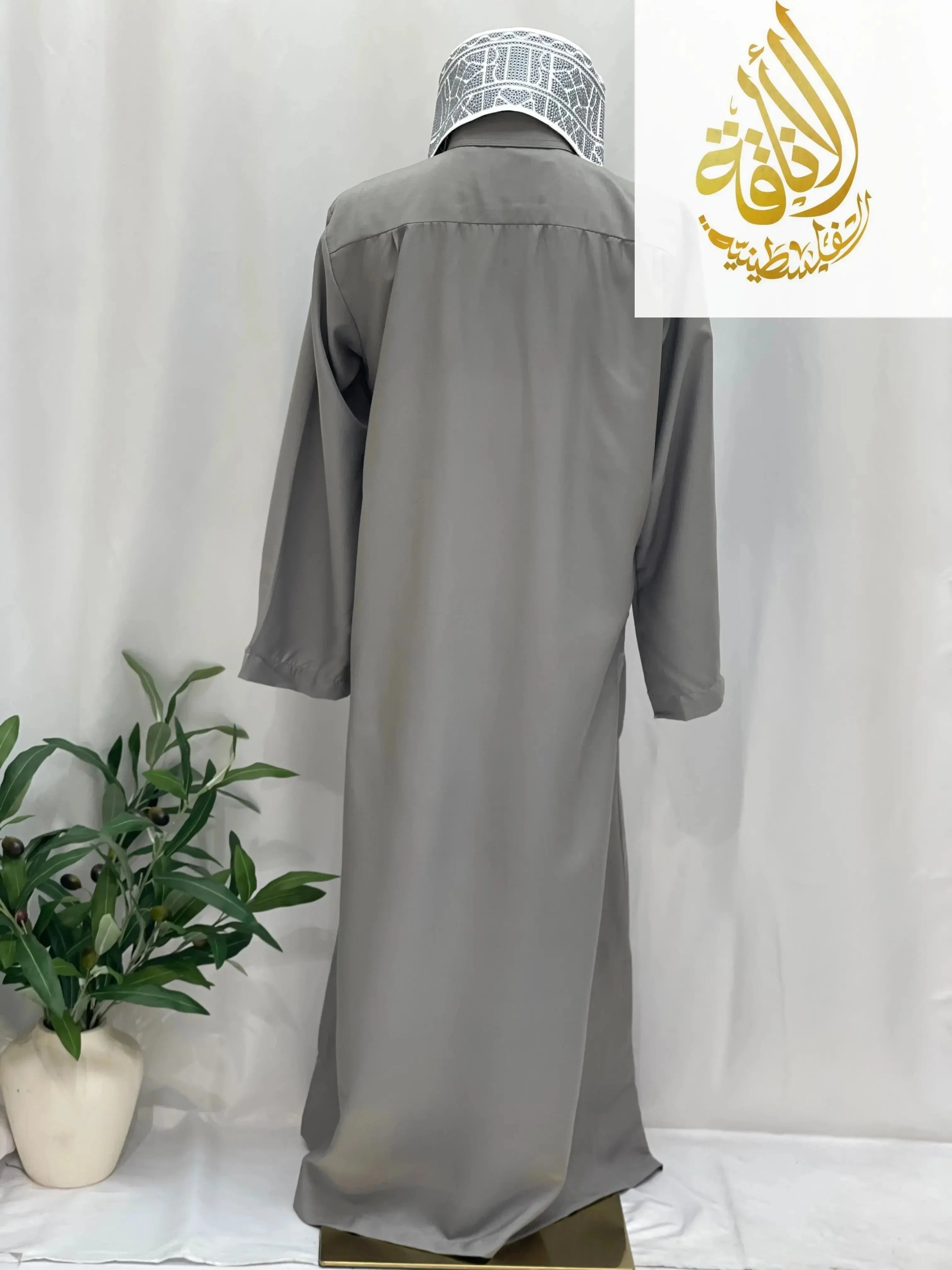 Back view of men's gray thobe from Palestinian Elegance with kids thobe with traditional embroidery style