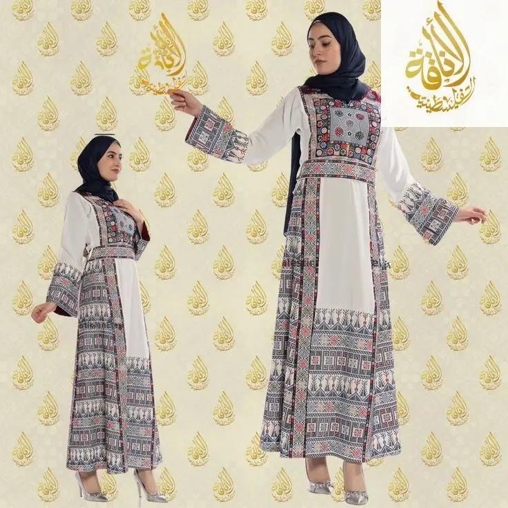 Woman wearing a traditional outfit with intricate patterns on a decorative background