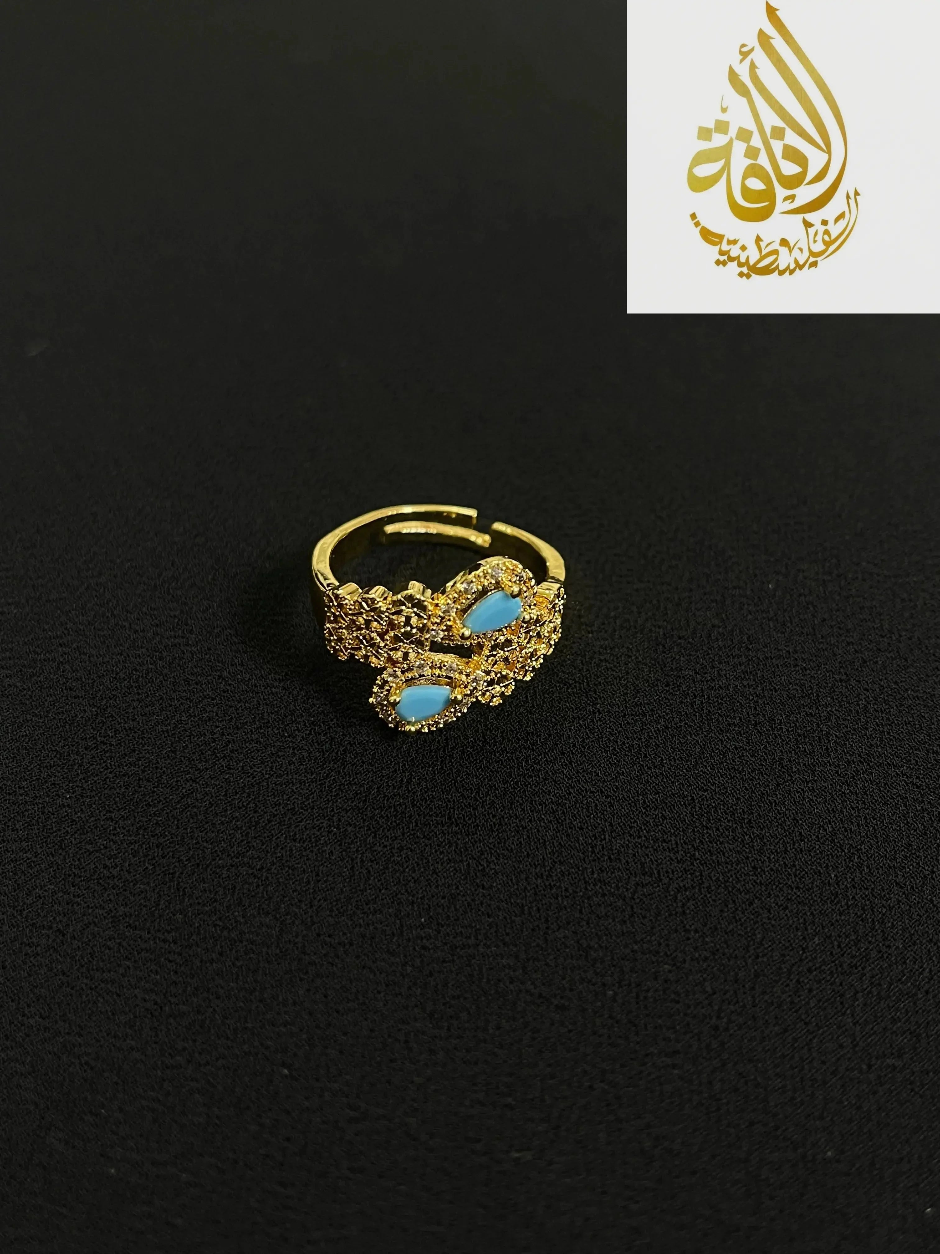 Delicate gold ring with turquoise stones from Palestinian gold jewelry set by Palestinian Elegance