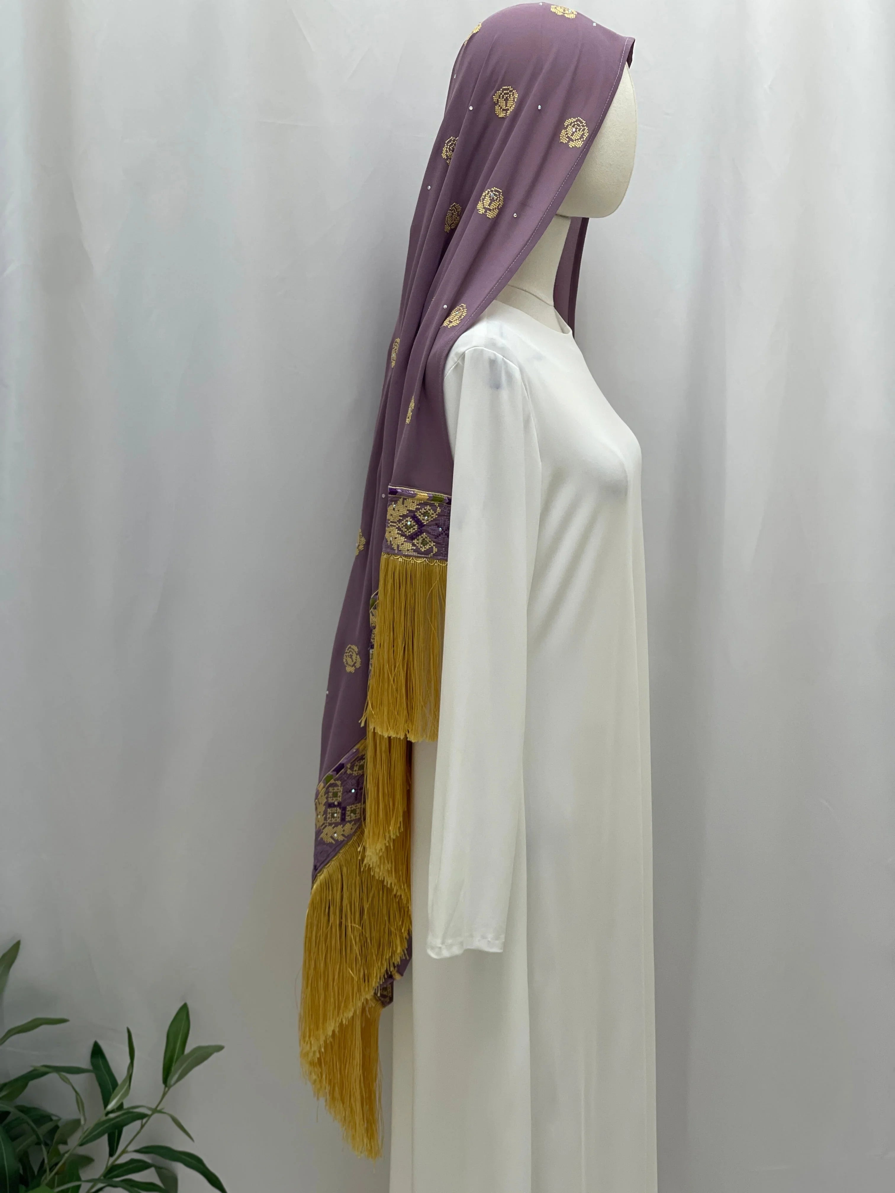 Warda Al-Karmeh Khirka-Shwal in Lavender with Gold Embroidery and Fringe Detail on a Dress Form