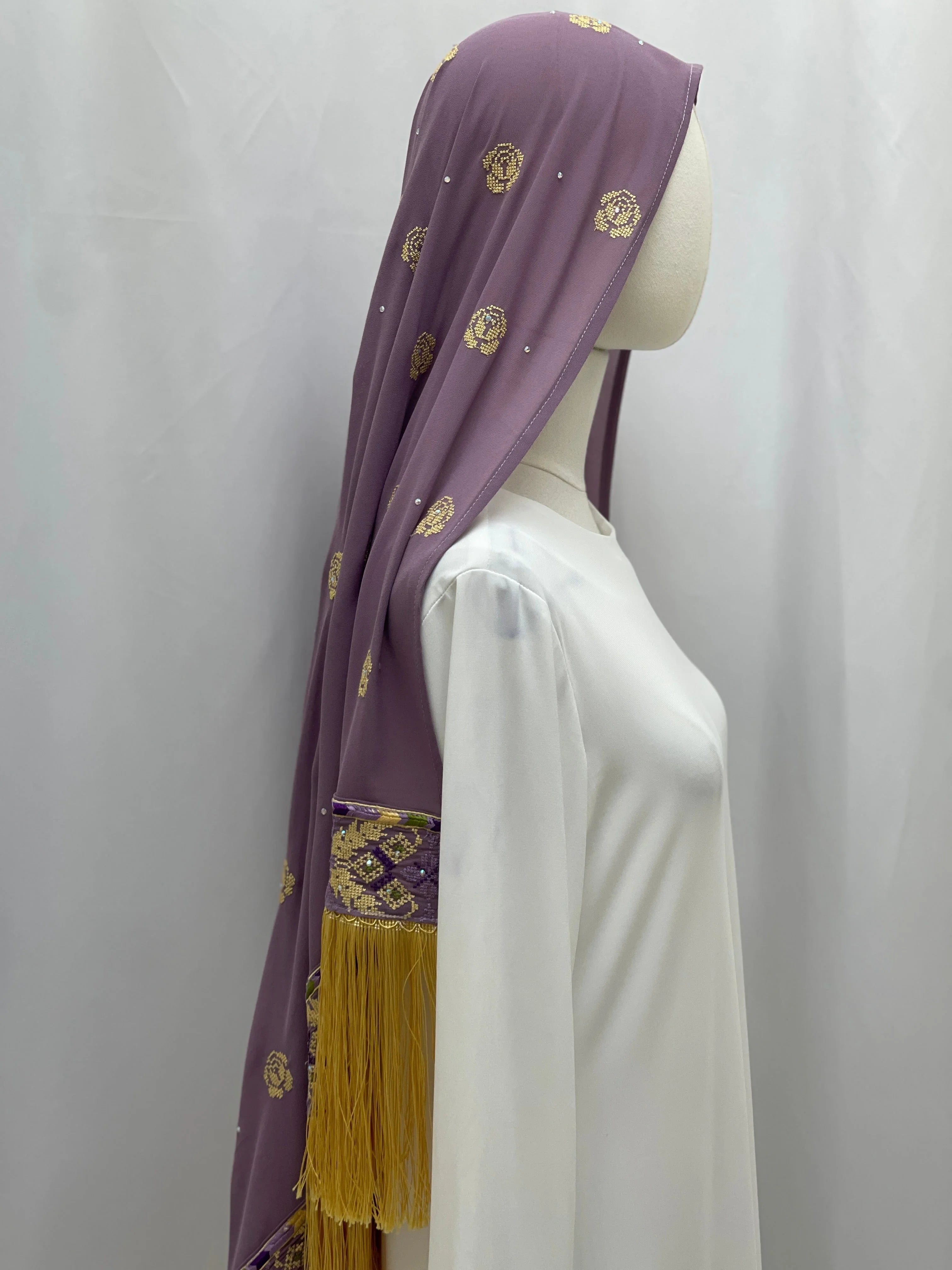 Warda Al-Karmeh Khirka-Shwal in lavender with decorative embroidery and fringe detailing