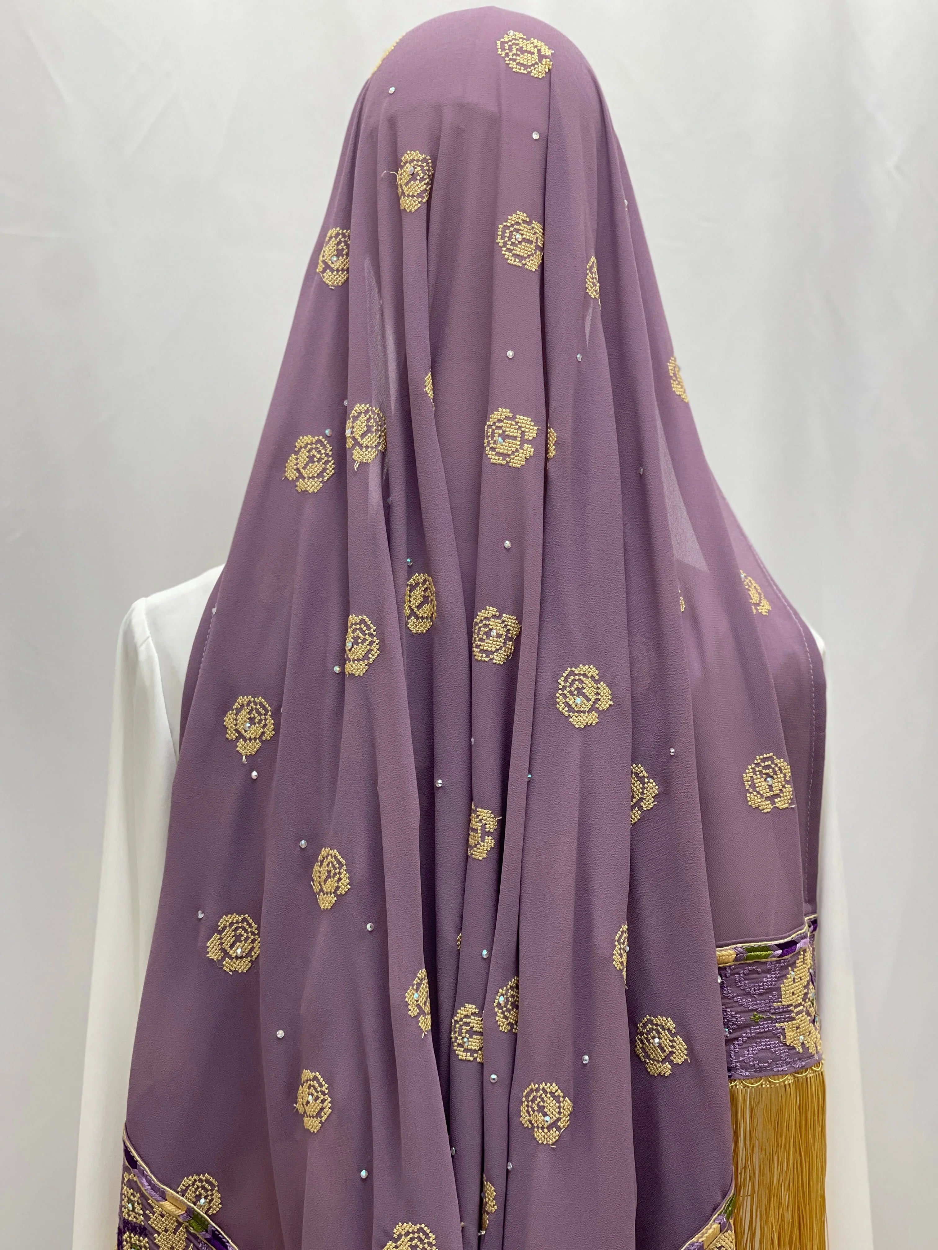 Warda Al-Karmeh Khirka-Shwal in lavender with floral embroidery and shimmering accents