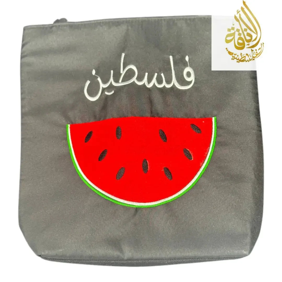 Palestinian watermelon tote bag with embroidered watermelon slice and Arabic script on gray fabric