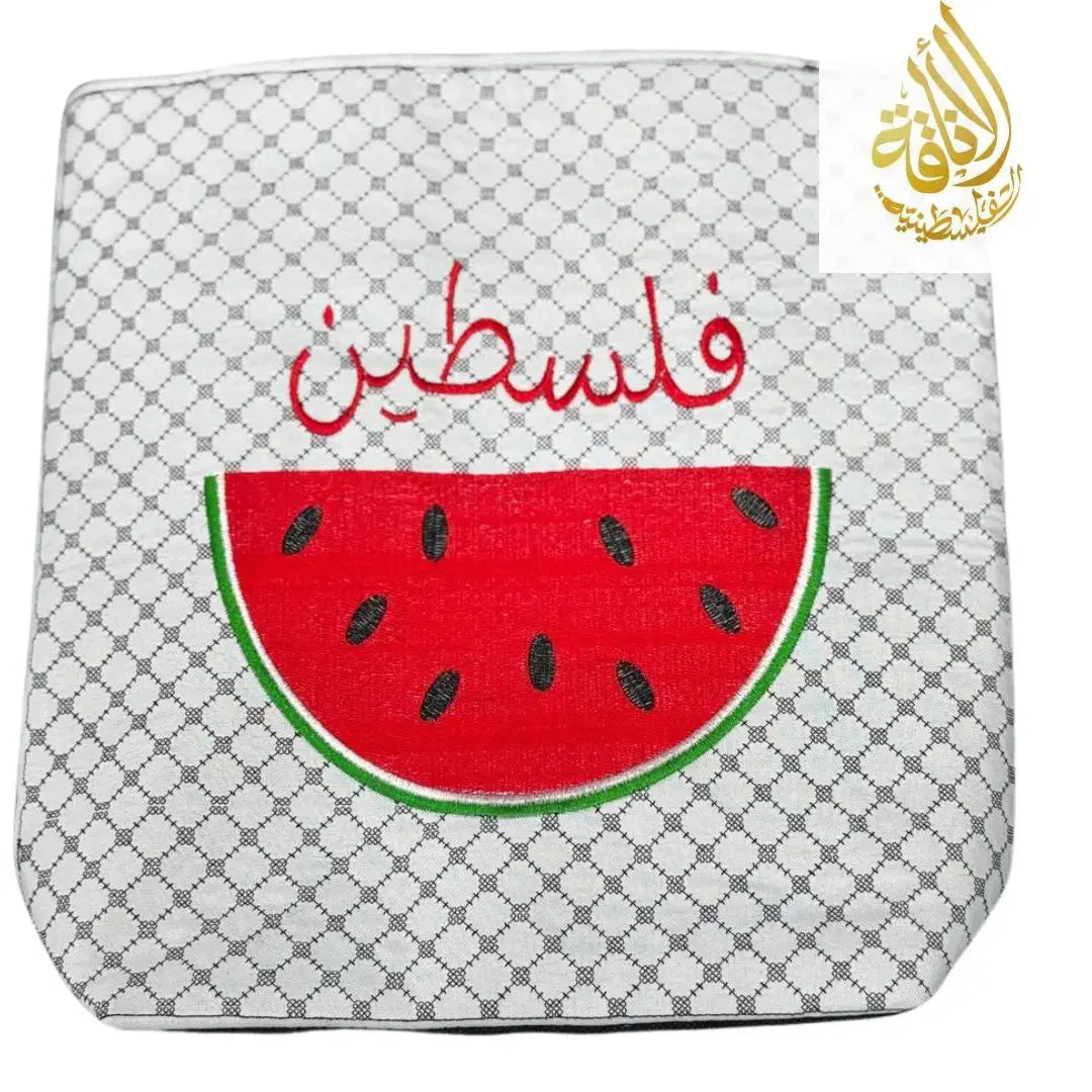 Palestinian watermelon tote bag with red watermelon design and Arabic script on patterned background