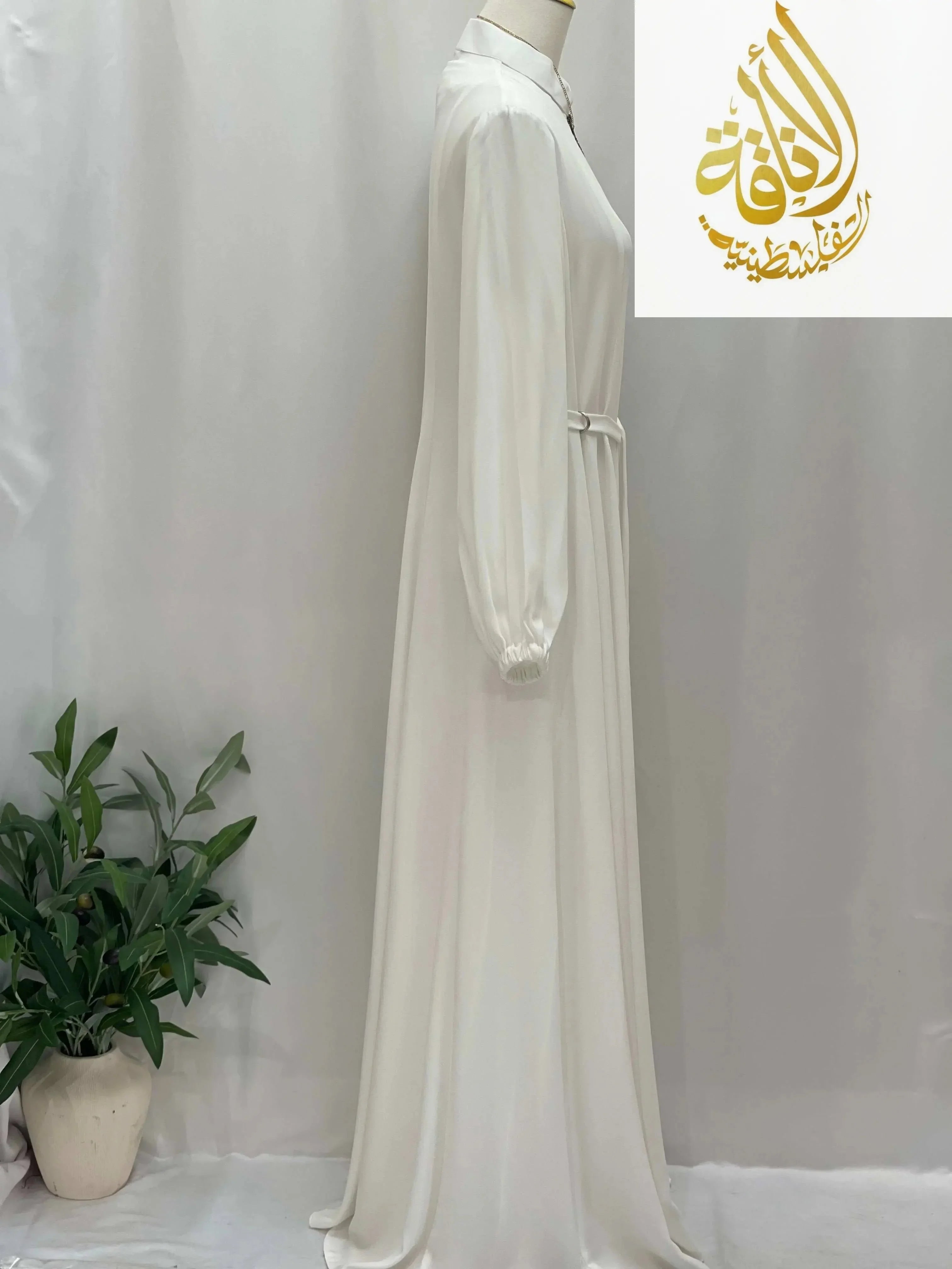 White Umra and Hajj Abaya by Palestinian Elegance with long sleeves and modest flowy design