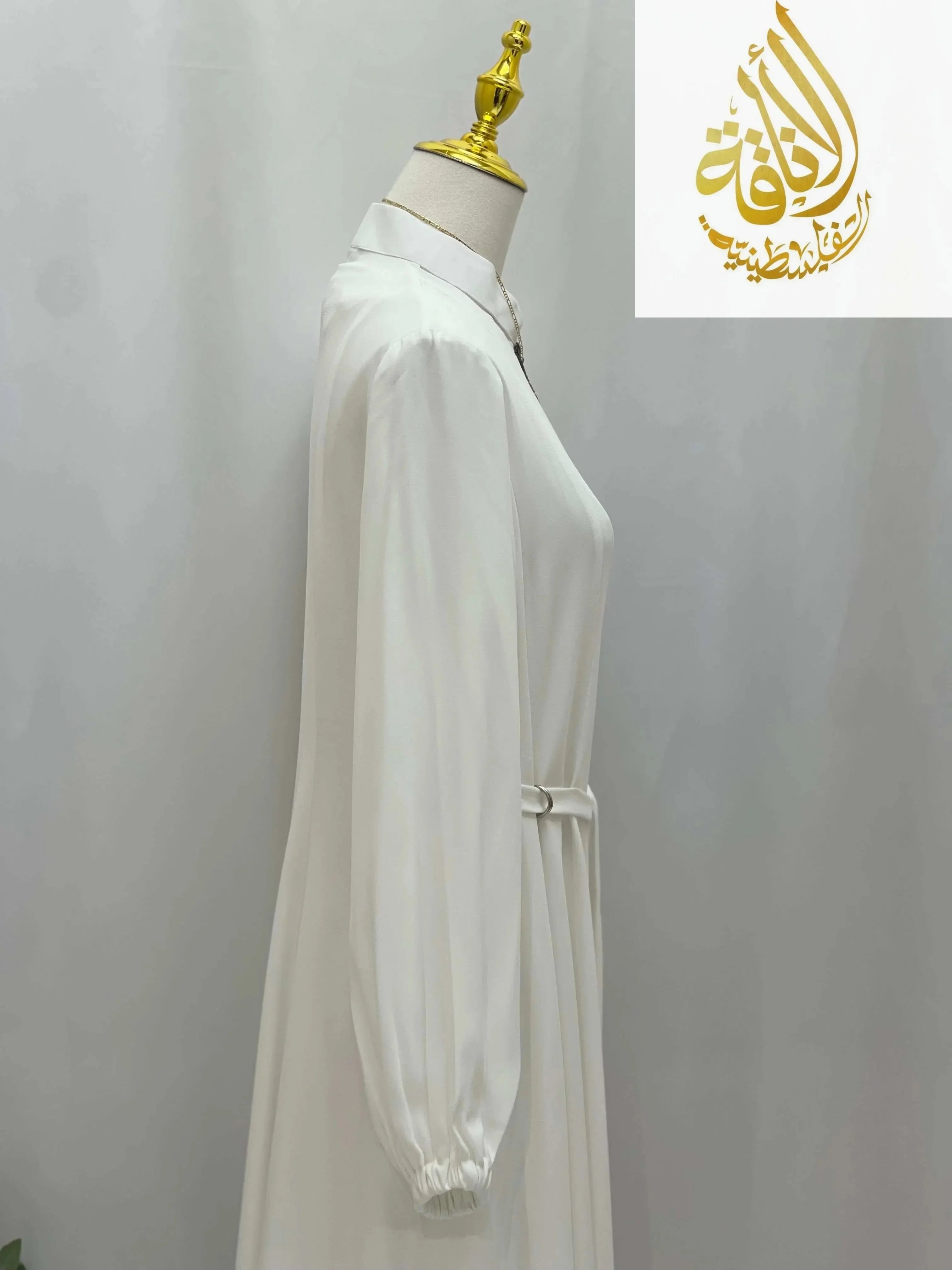 White Umra and Hajj Abaya by Palestinian Elegance with long sleeves and gathered cuffs
