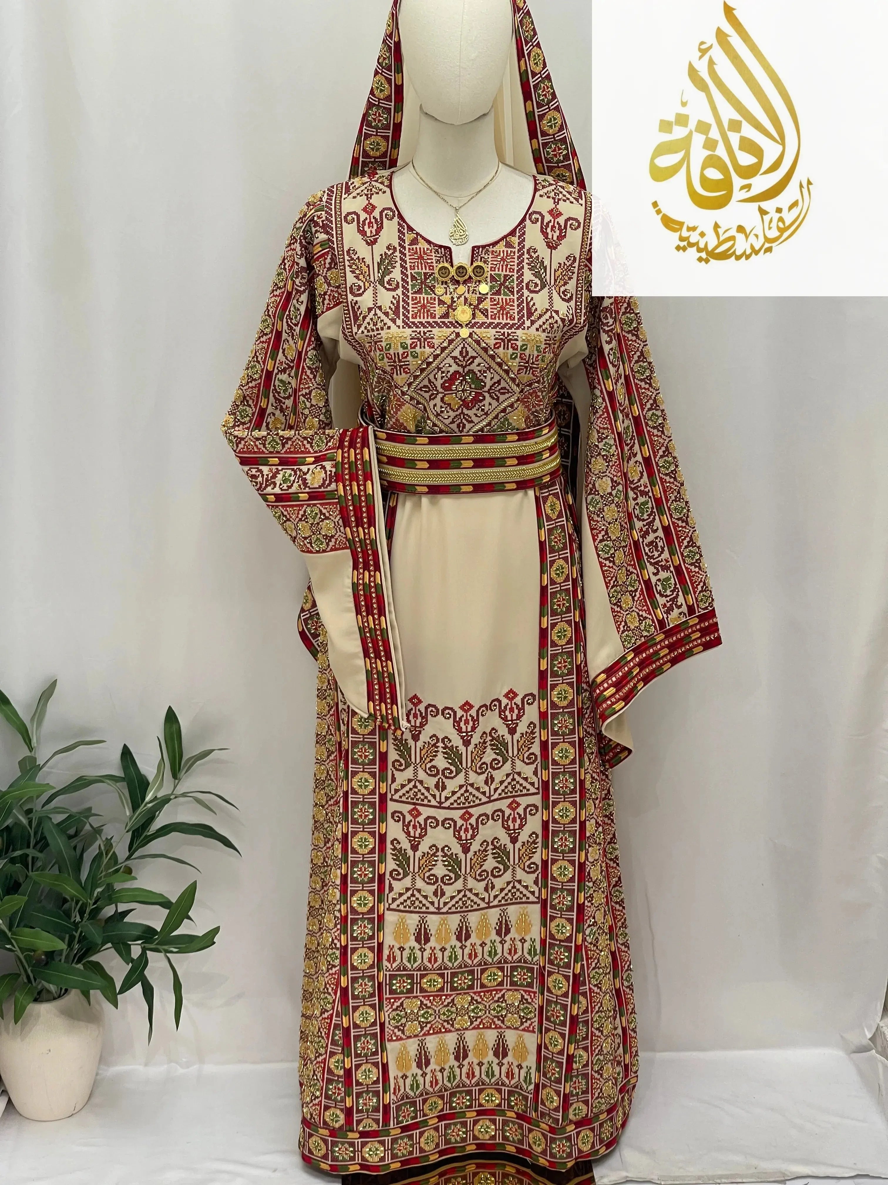 Palestinian Elegance Gold Beads Thoub with intricate red and gold embroidery on beige fabric