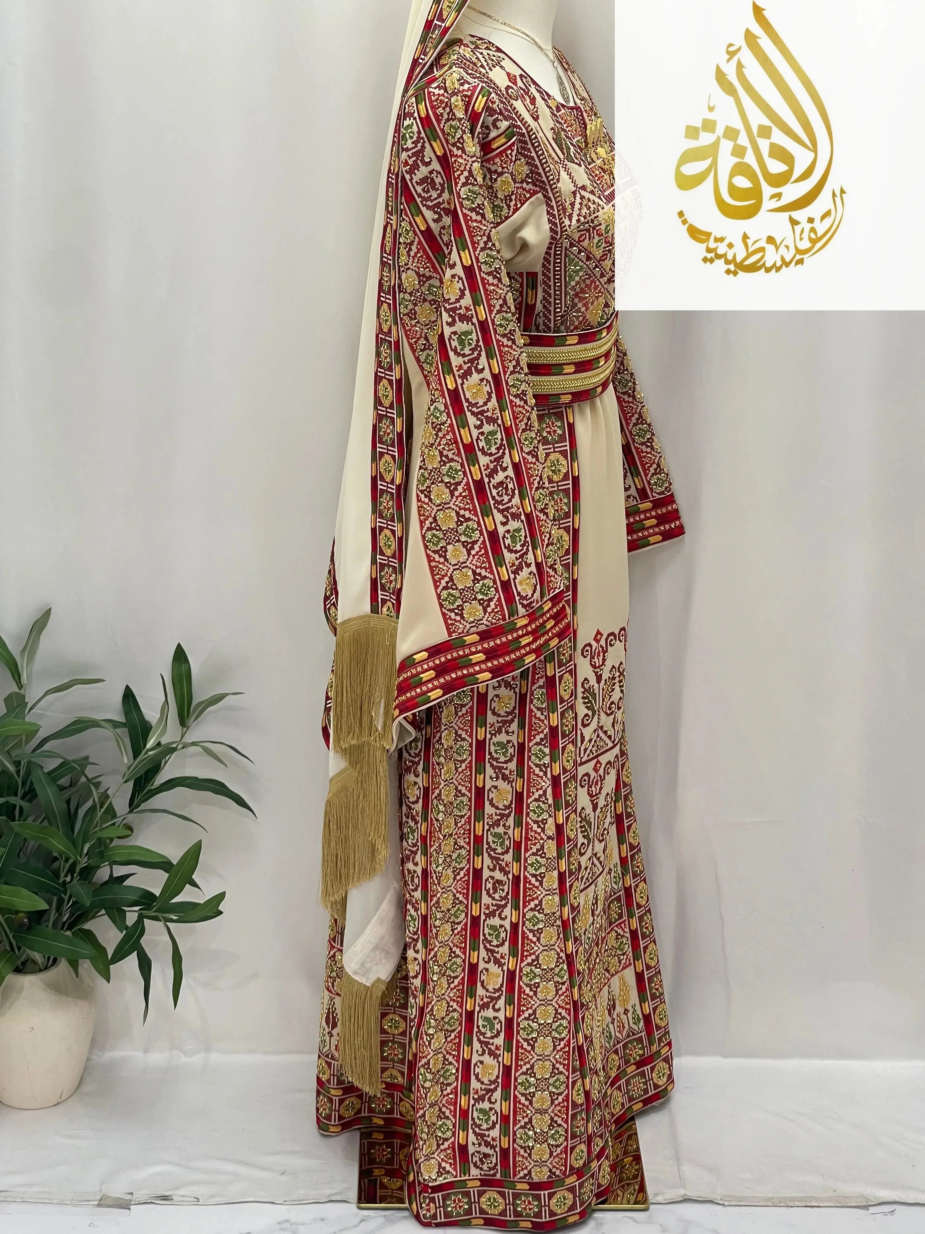 Palestinian Elegance traditional Gold Beads Thoub with intricate red and gold embroidery on mannequin