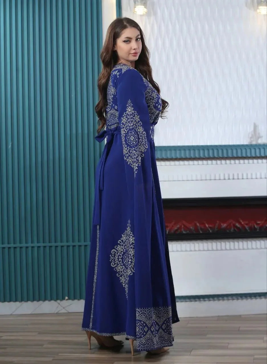 Palestinian Elegance blue embroidered kaftan dress with intricate silver designs and long sleeves