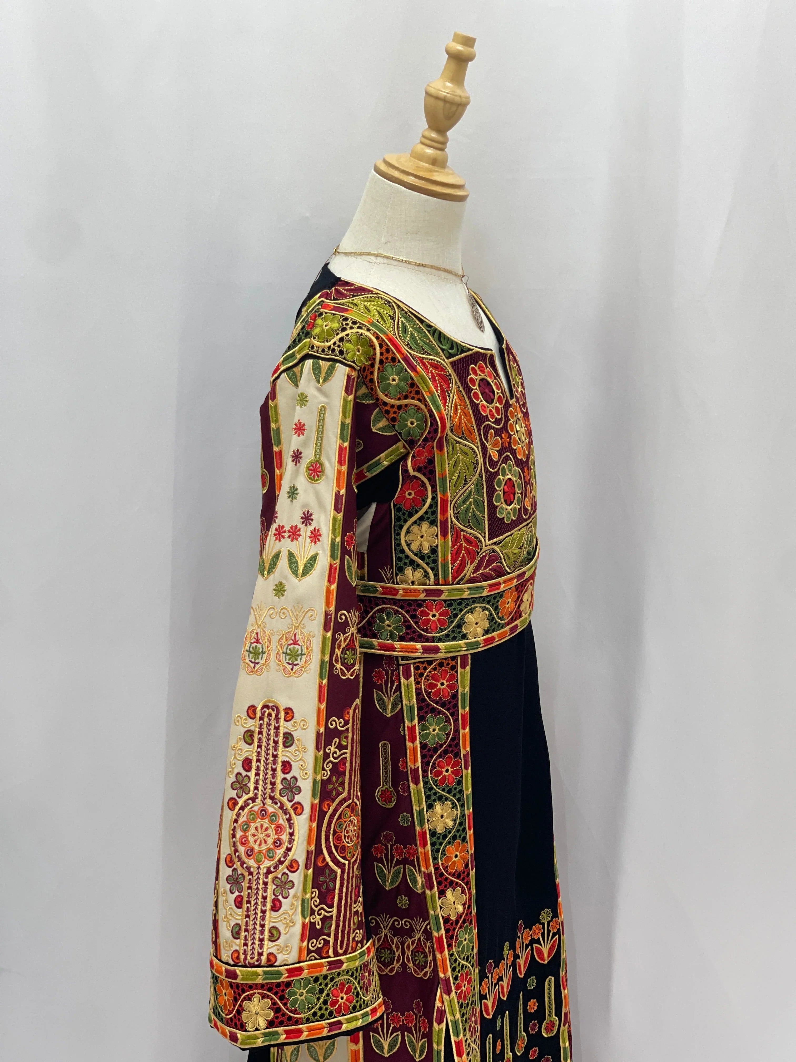 Colorful Embroidered Girls Thoub featuring intricate floral patterns and elegant long sleeves