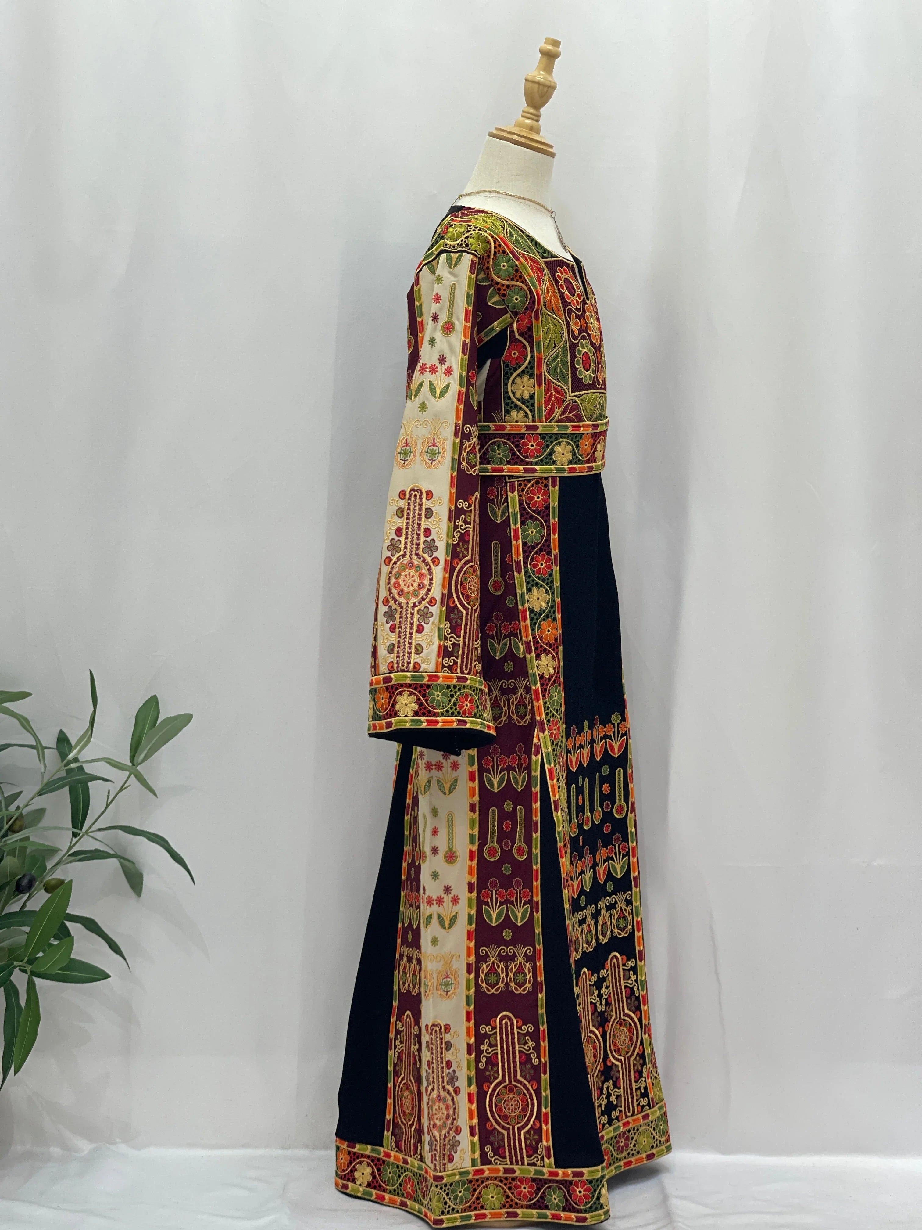 Embroidered Girls Thoub in vibrant colors with traditional Palestinian patterns for special occasions