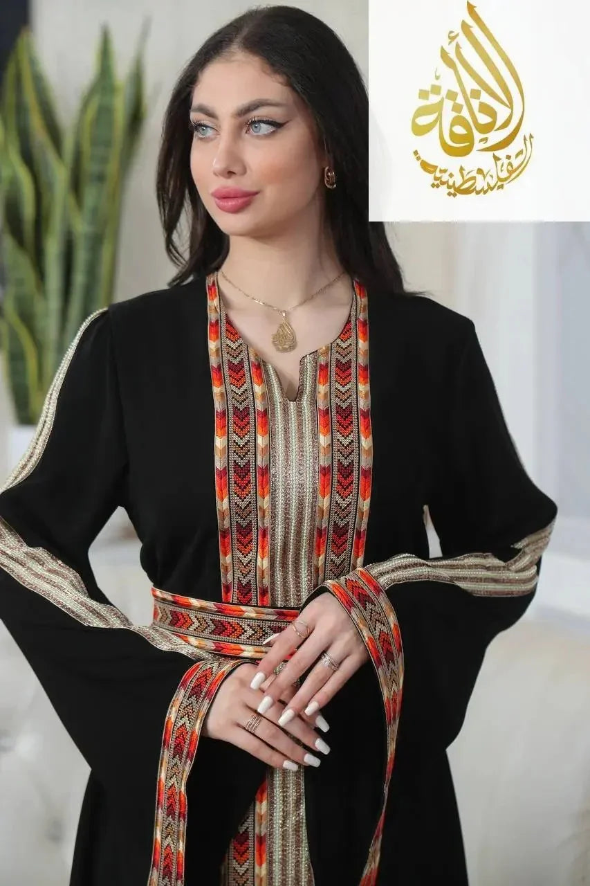 Palestinian Elegance Zena Embroidered Thoub in black with intricate colorful embroidery on neckline and sleeves