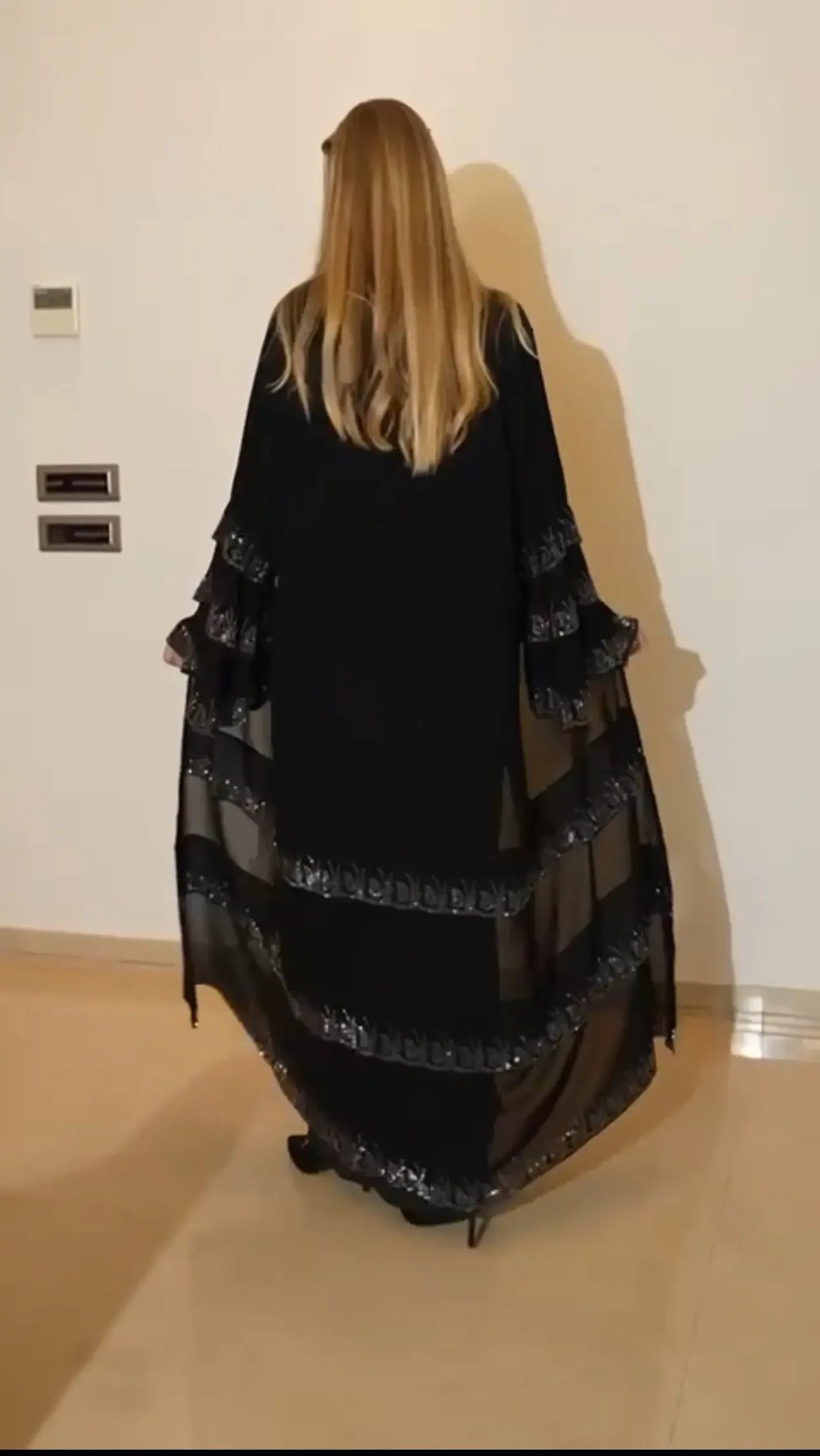 Black abaya with strass embellishments featuring layered sheer fabric on sleeves and hem by Palestinian Elegance