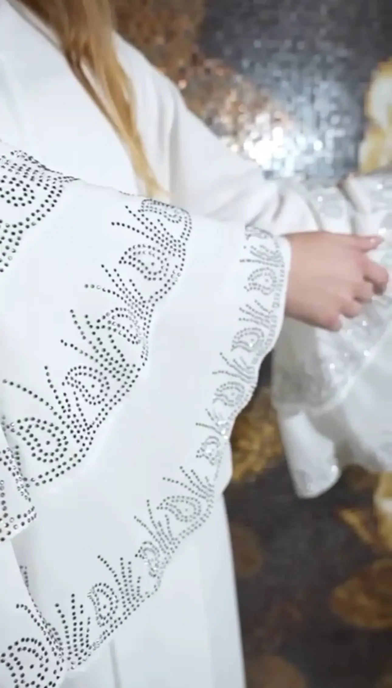 White abaya with strass embellishments on sleeve edges by Palestinian Elegance