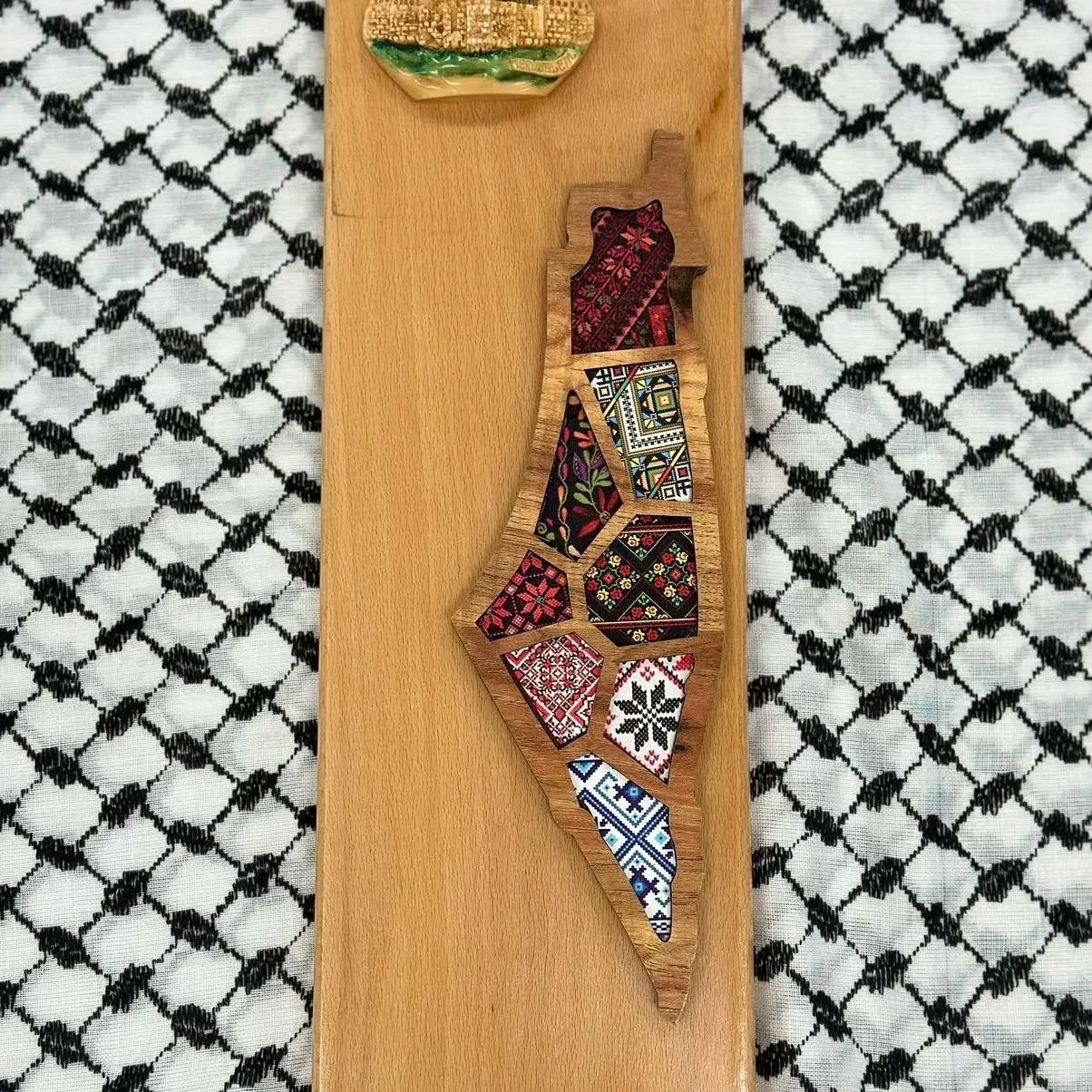 Handmade Palestine map wall art with colorful embroidered patterns on wooden base from Palestinian Elegance