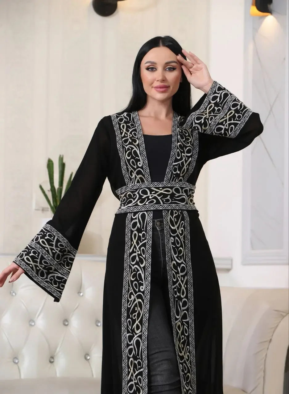Black Arabic letter embroidered cardigan by Palestinian Elegance with intricate silver embroidery on sleeves and front
