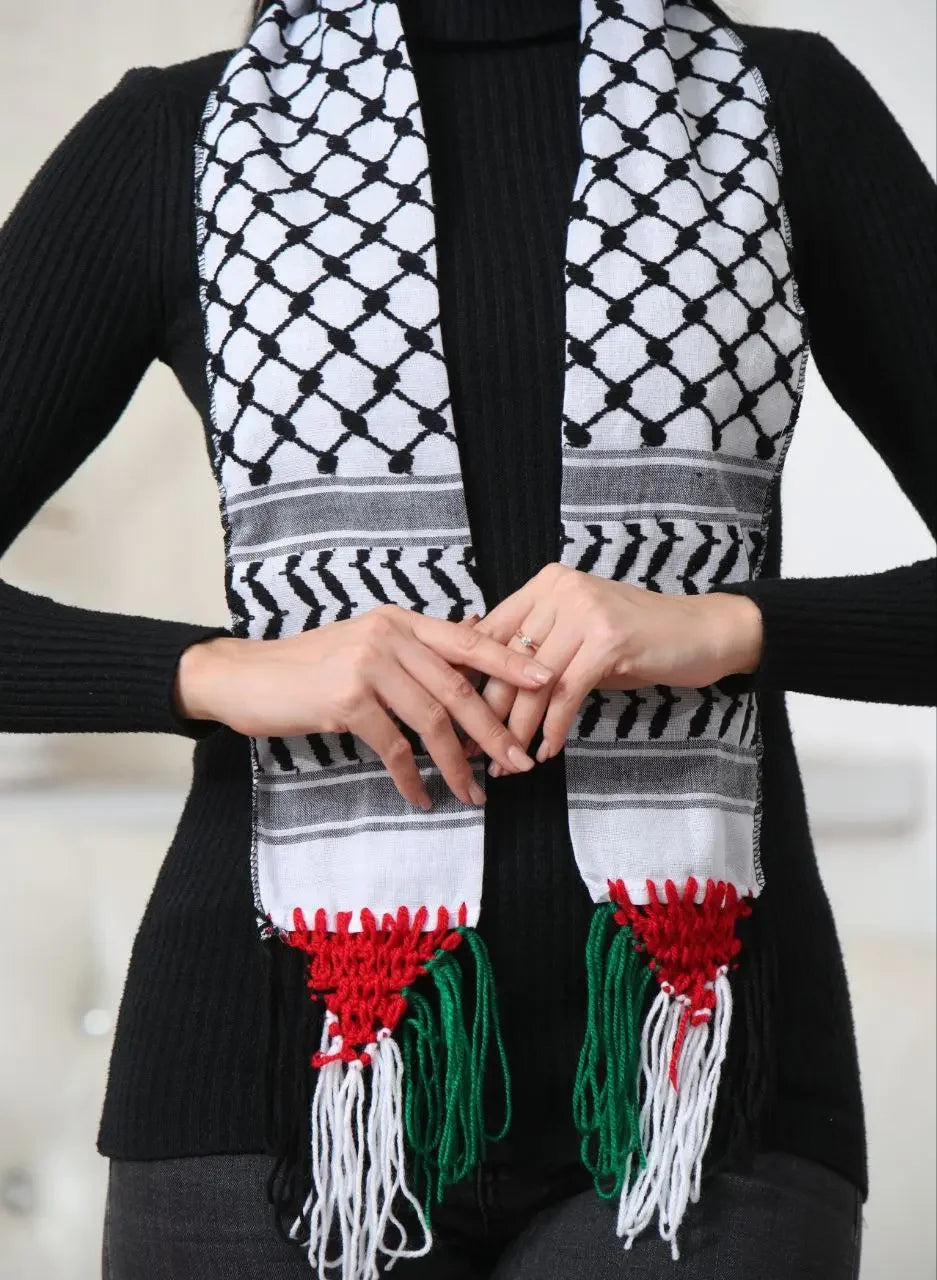 Authentic Palestinian keffiyeh scarf with traditional black and white pattern and red green white tassels