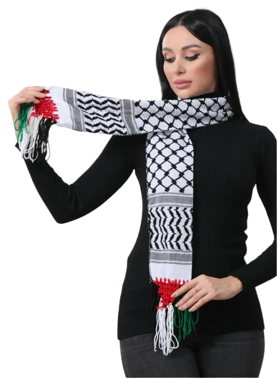 Woman wearing authentic Palestinian keffiyeh scarf with traditional black and white pattern and red green tassels