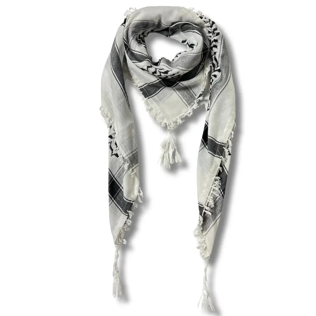 Authentic Palestinian kuffiyeh scarf in black and white with traditional patterns and tassels