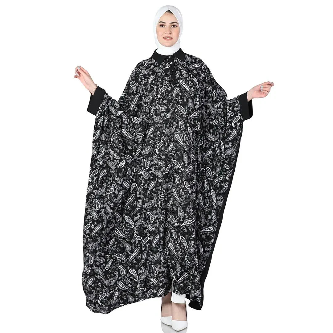 Palestinian Elegance black and white bandana abaya dress with intricate paisley patterns worn with white hijab