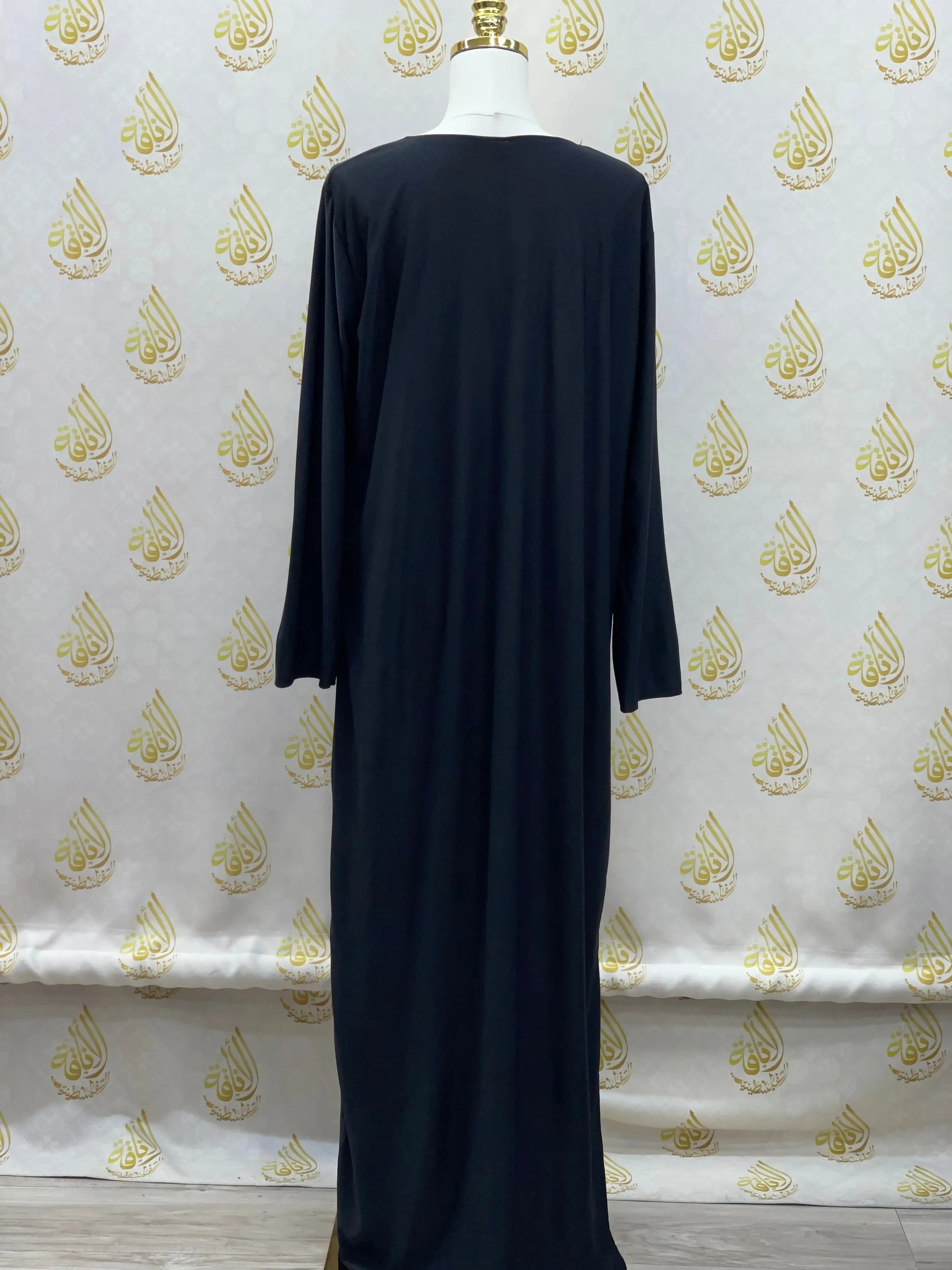 Palestinian Elegance basic solid dress in black with long sleeves and modest design