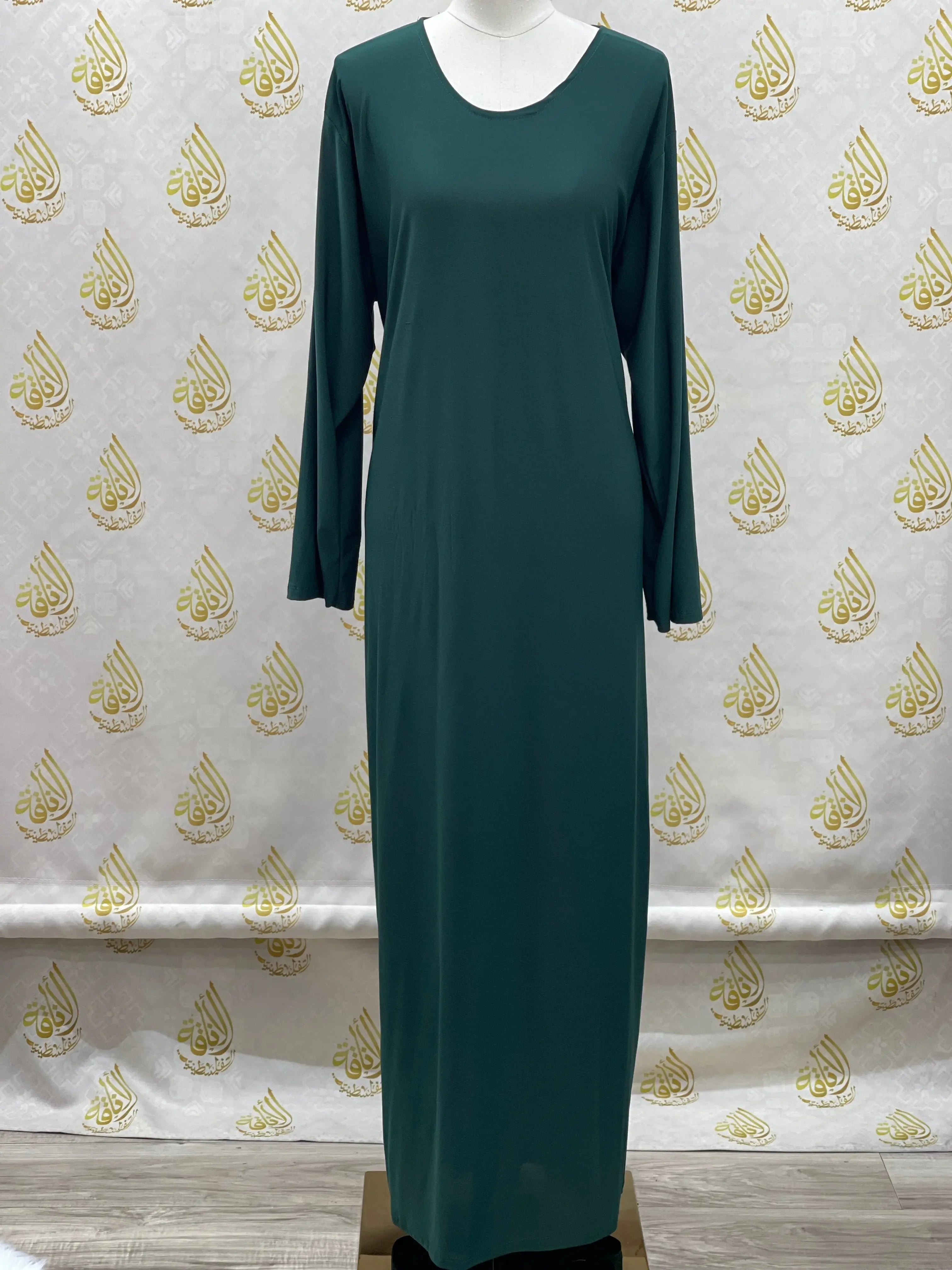Palestinian elegance basic solid dress in dark green with long sleeves and a round neckline