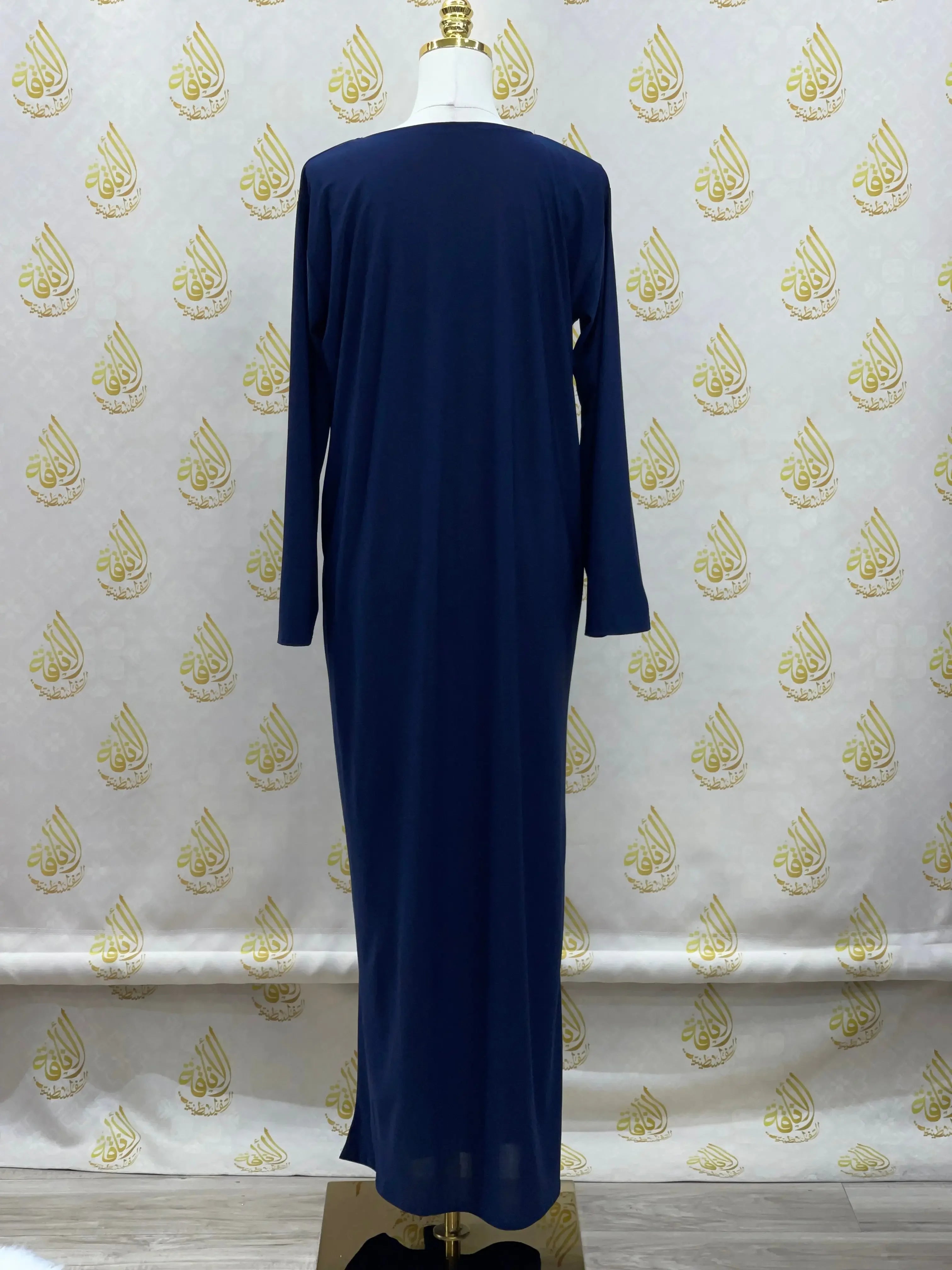 Palestinian Elegance basic solid dress in navy blue with long sleeves and a simple full-length design