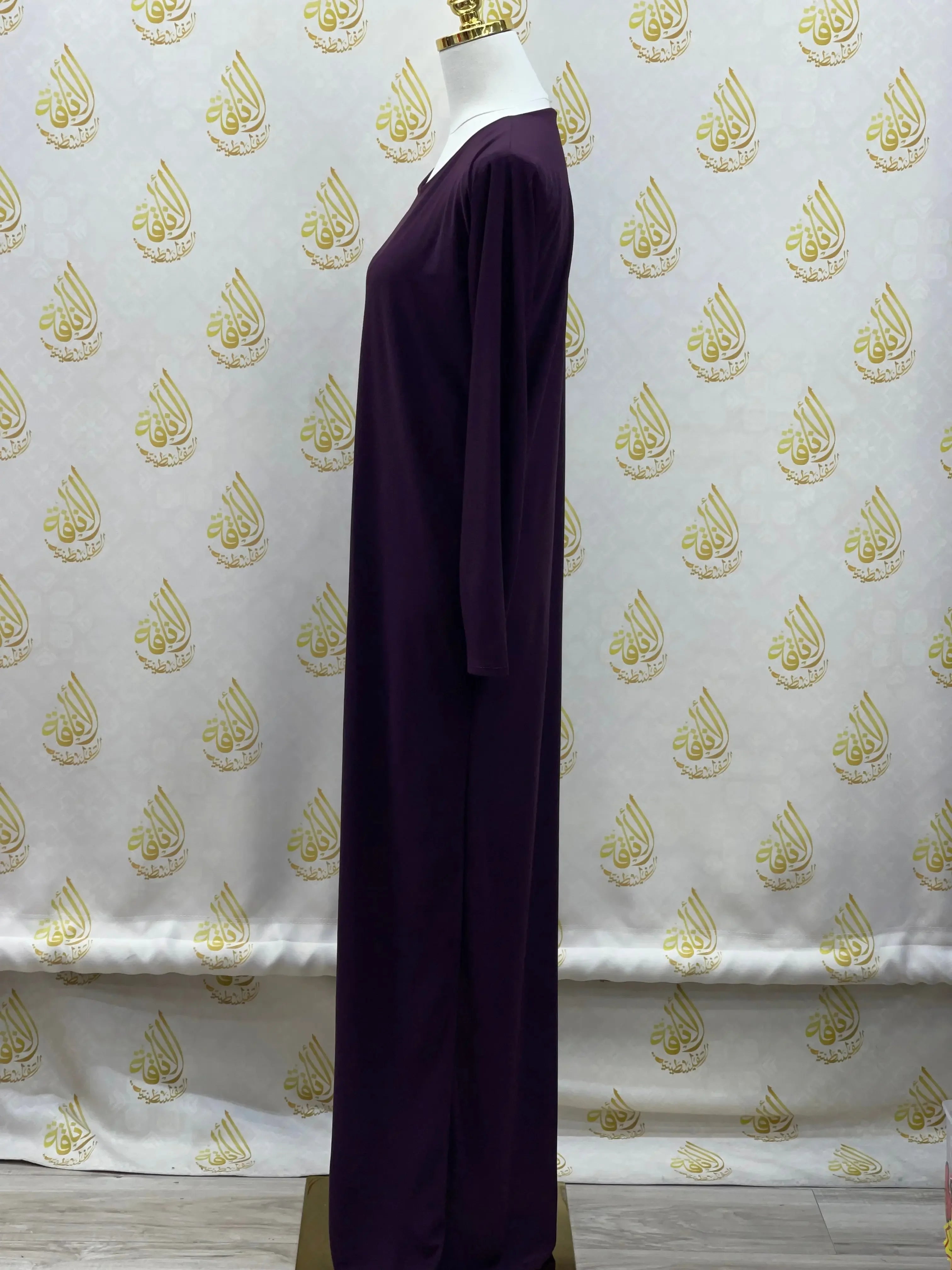 Palestinian Elegance basic solid dress in deep purple with long sleeves and a modest silhouette