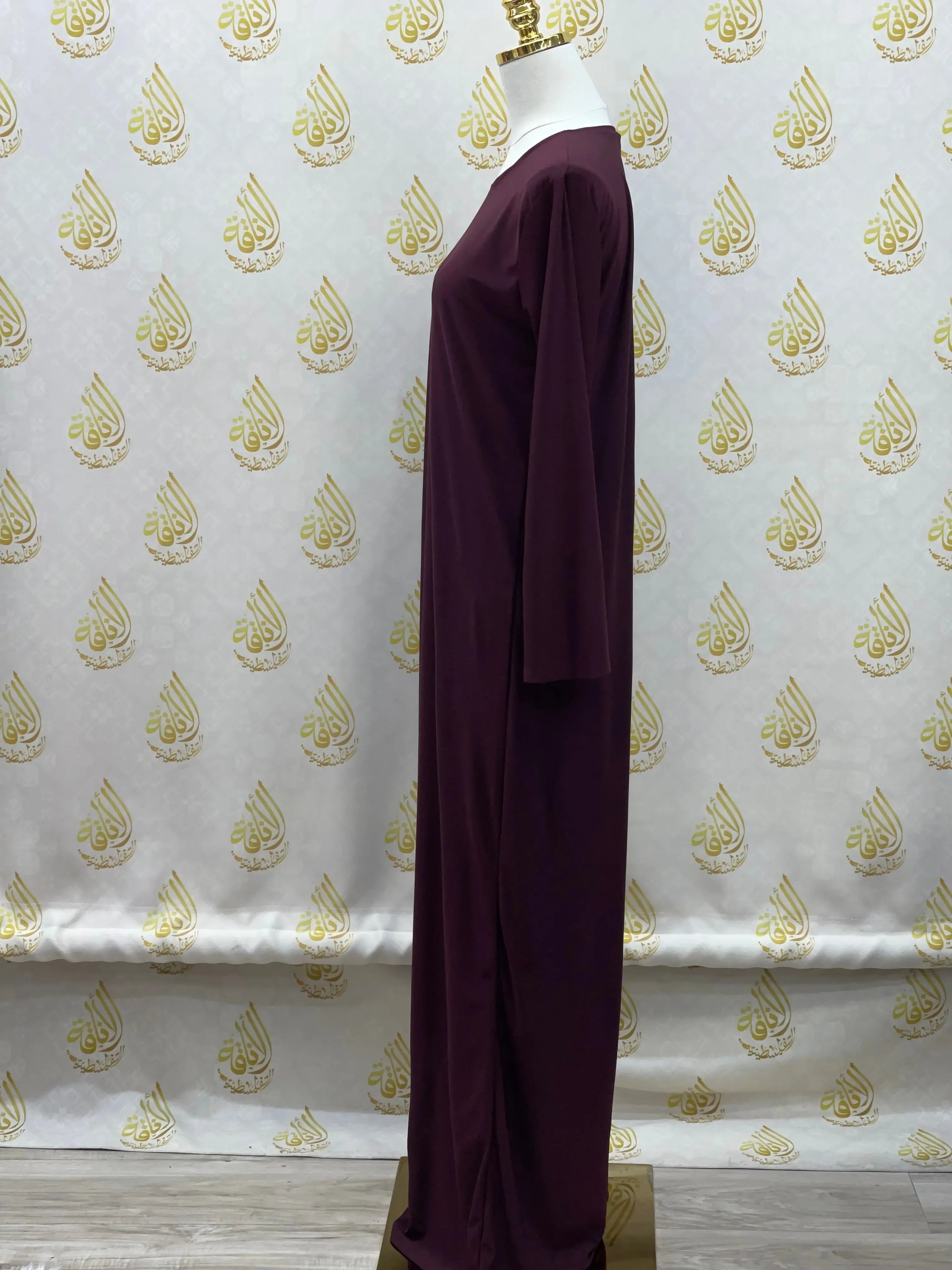 Palestinian Elegance basic solid dress in deep purple with long sleeves and modest design