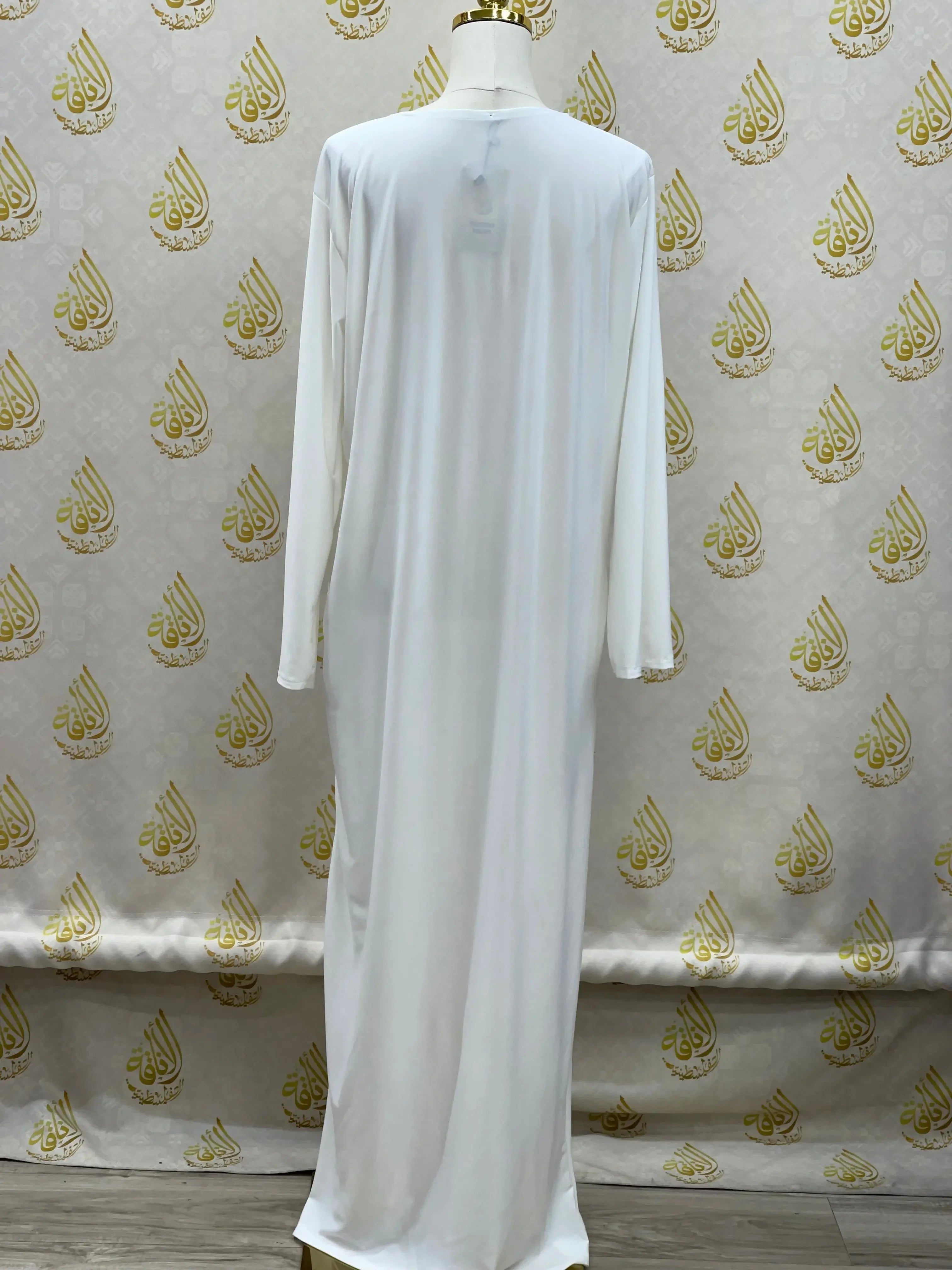 Palestinian Elegance basic solid dress in white with long sleeves and full length design
