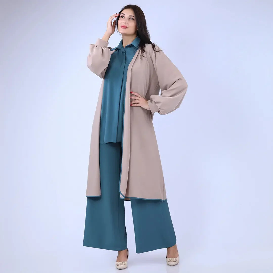 Palestinian Elegance beige long cardigan with balloon sleeves styled with teal wide-leg pants and blouse
