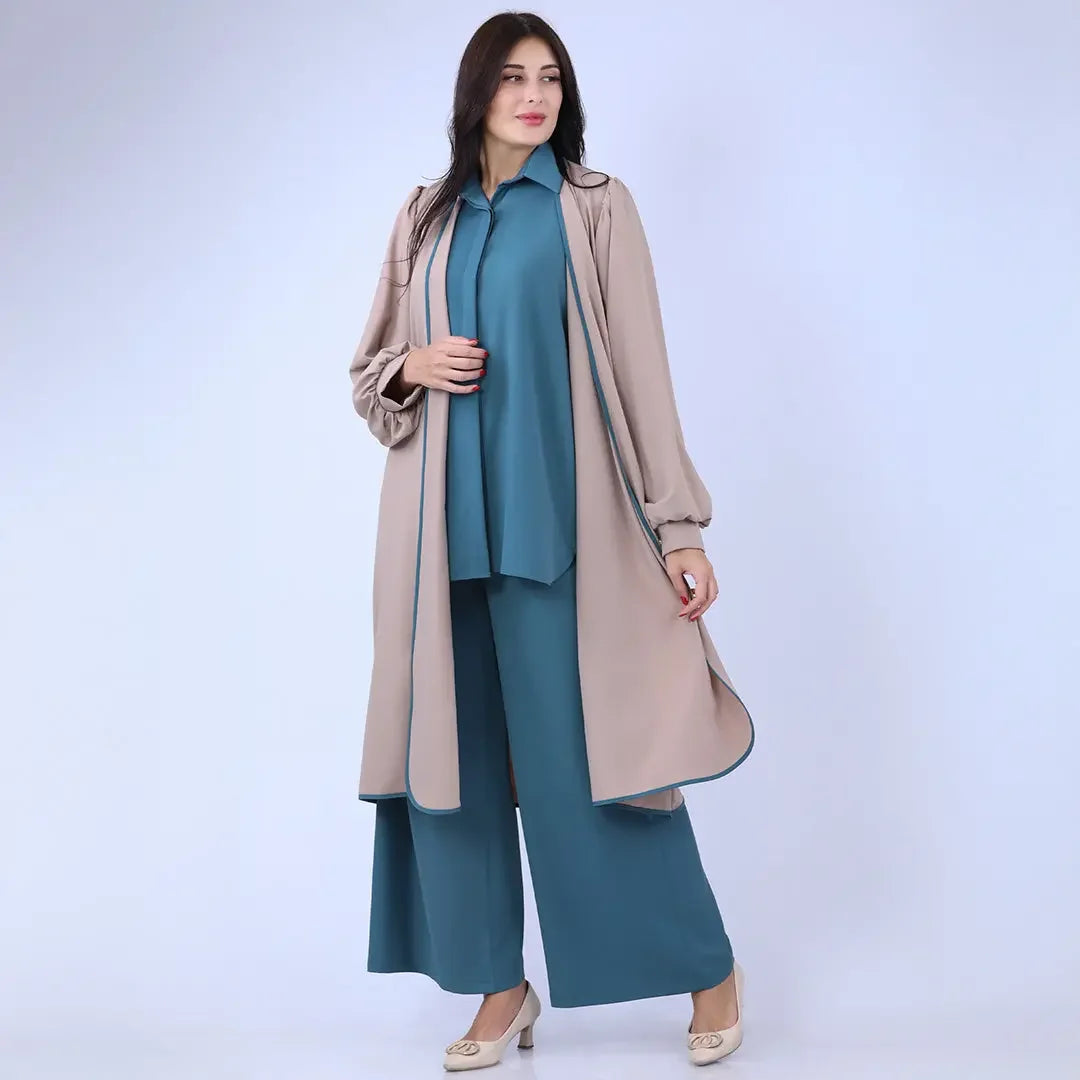 Palestinian Elegance beige open front cardigan with long sleeves styled over teal wide-leg pants and shirt