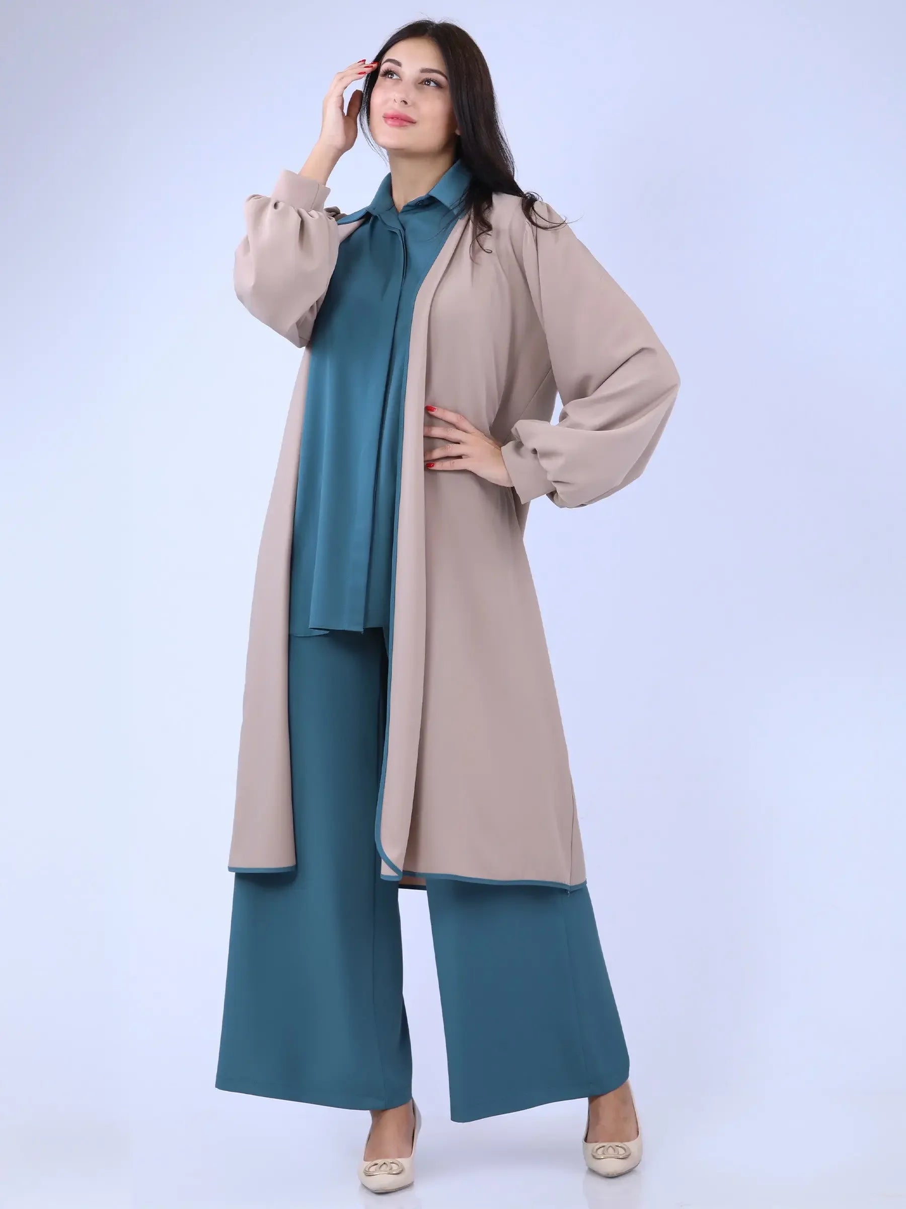 Palestinian Elegance beige long cardigan with balloon sleeves worn over teal wide-leg pants and matching shirt
