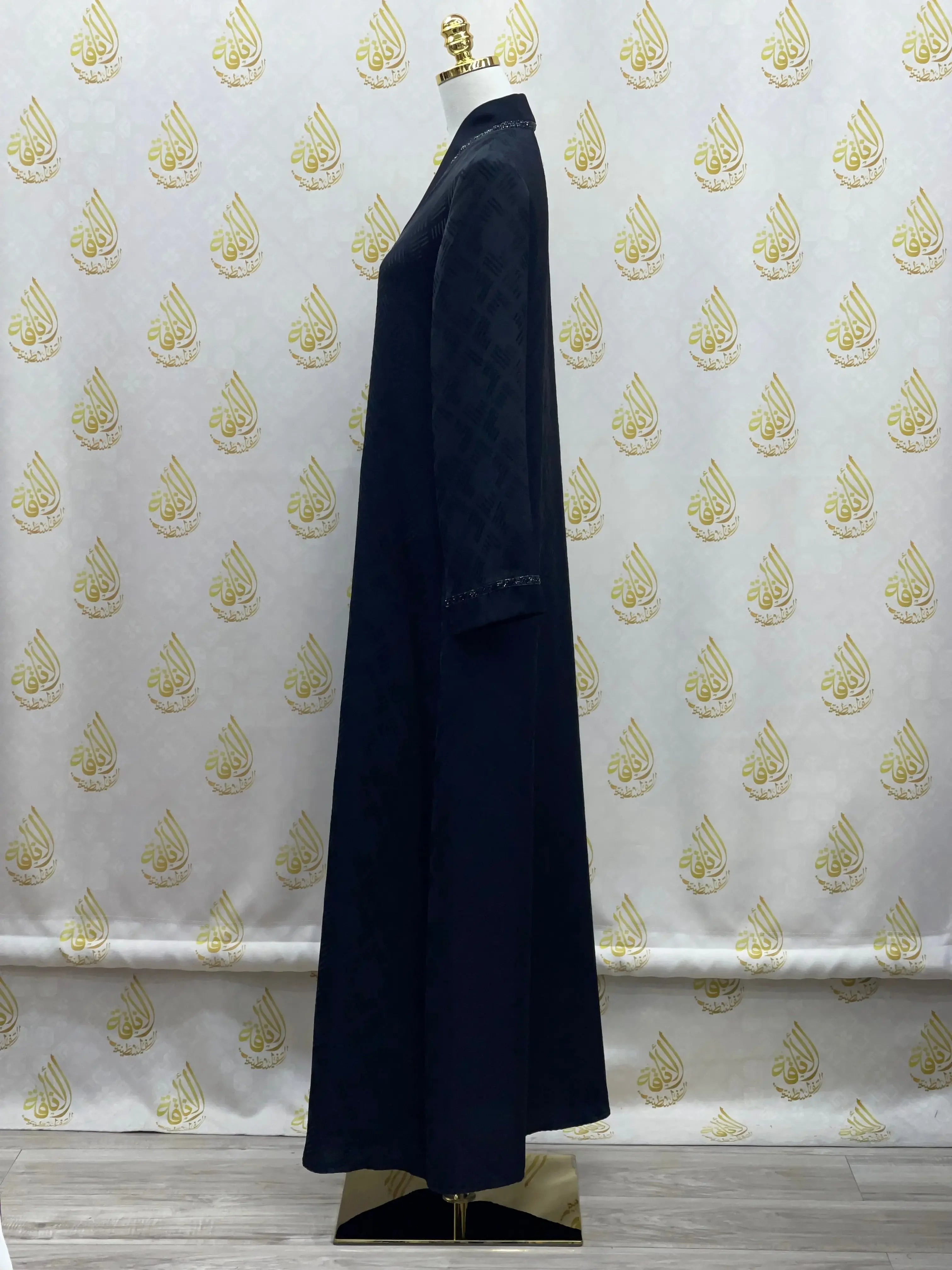 Palestinian Elegance black abaya for women with long sleeves and subtle textured details
