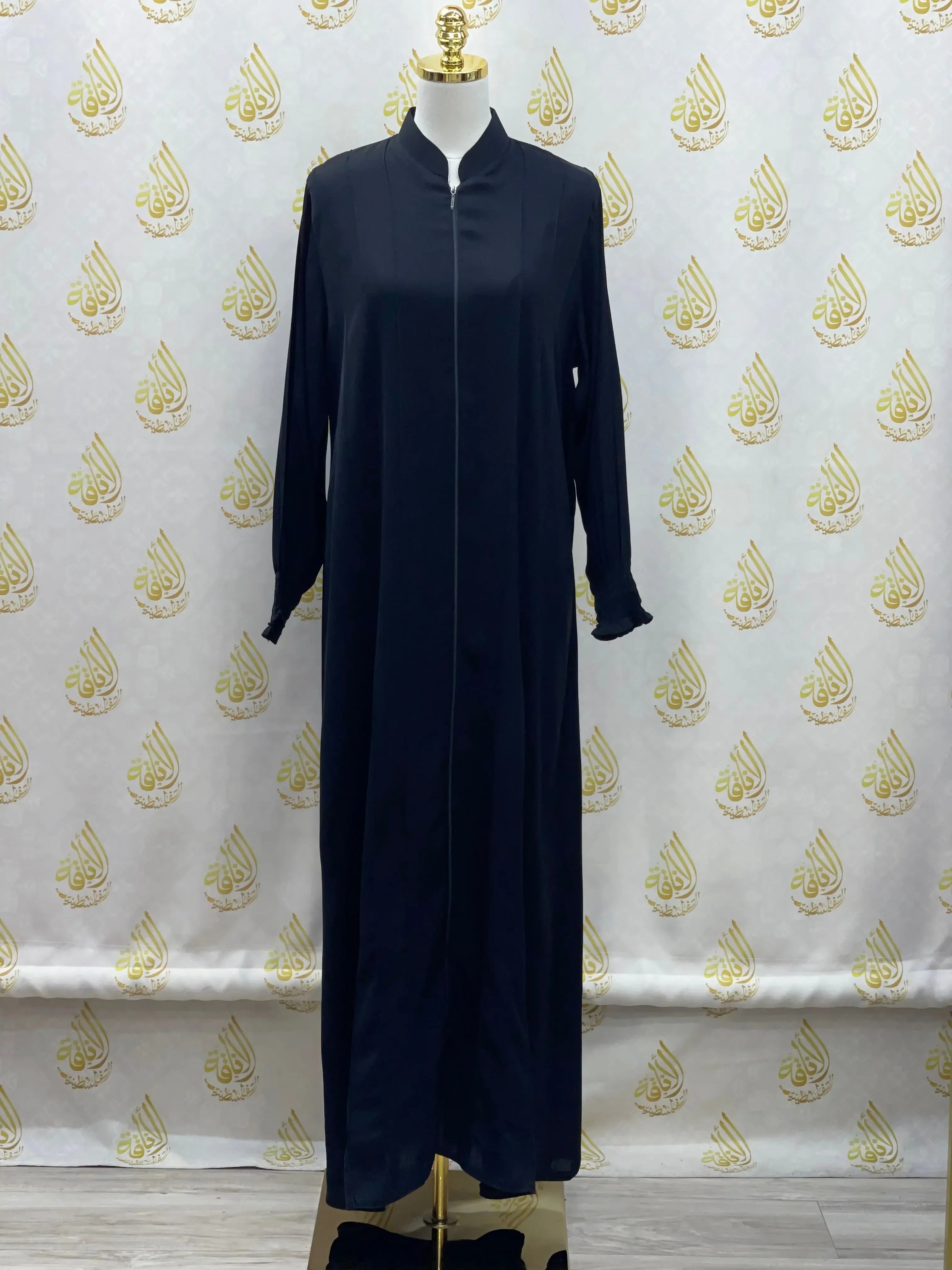 Palestinian Elegance black abaya with embroidery displayed on a mannequin with long sleeves and stand collar