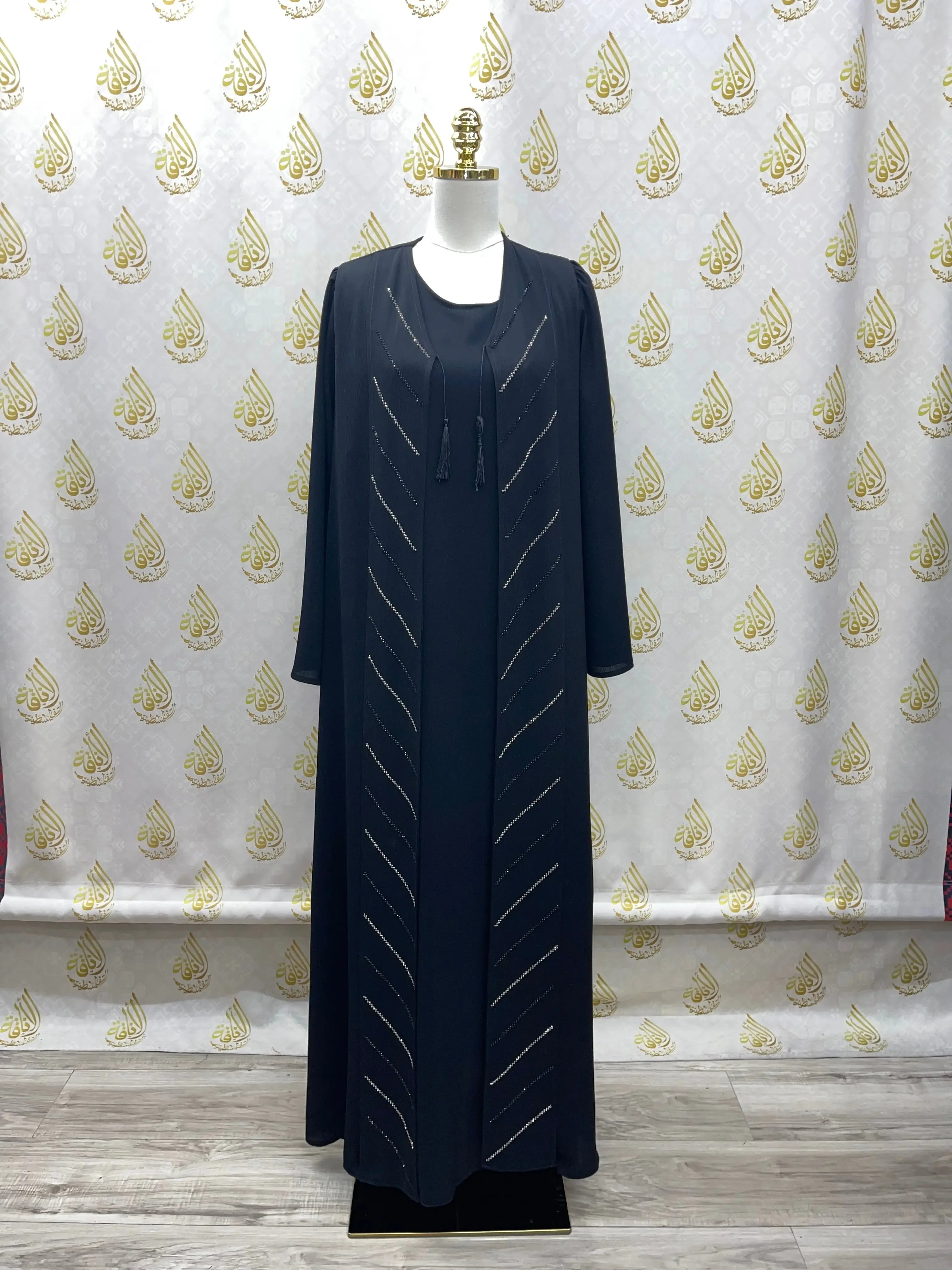 Black Abaya with Strass by Palestinian Elegance featuring elegant diagonal strass detailing on front