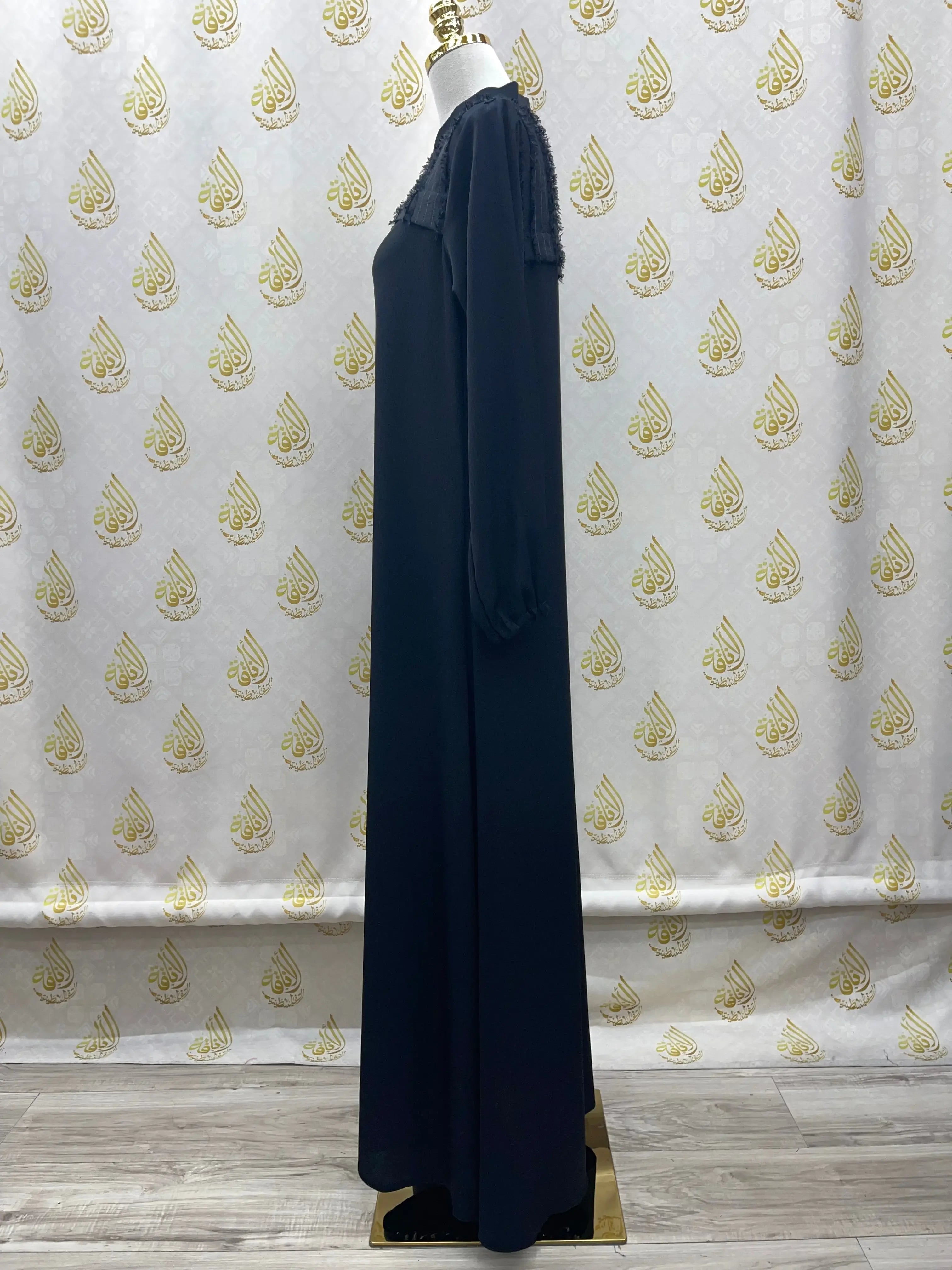 Black casual abaya for women with long sleeves and lace detail by Palestinian Elegance