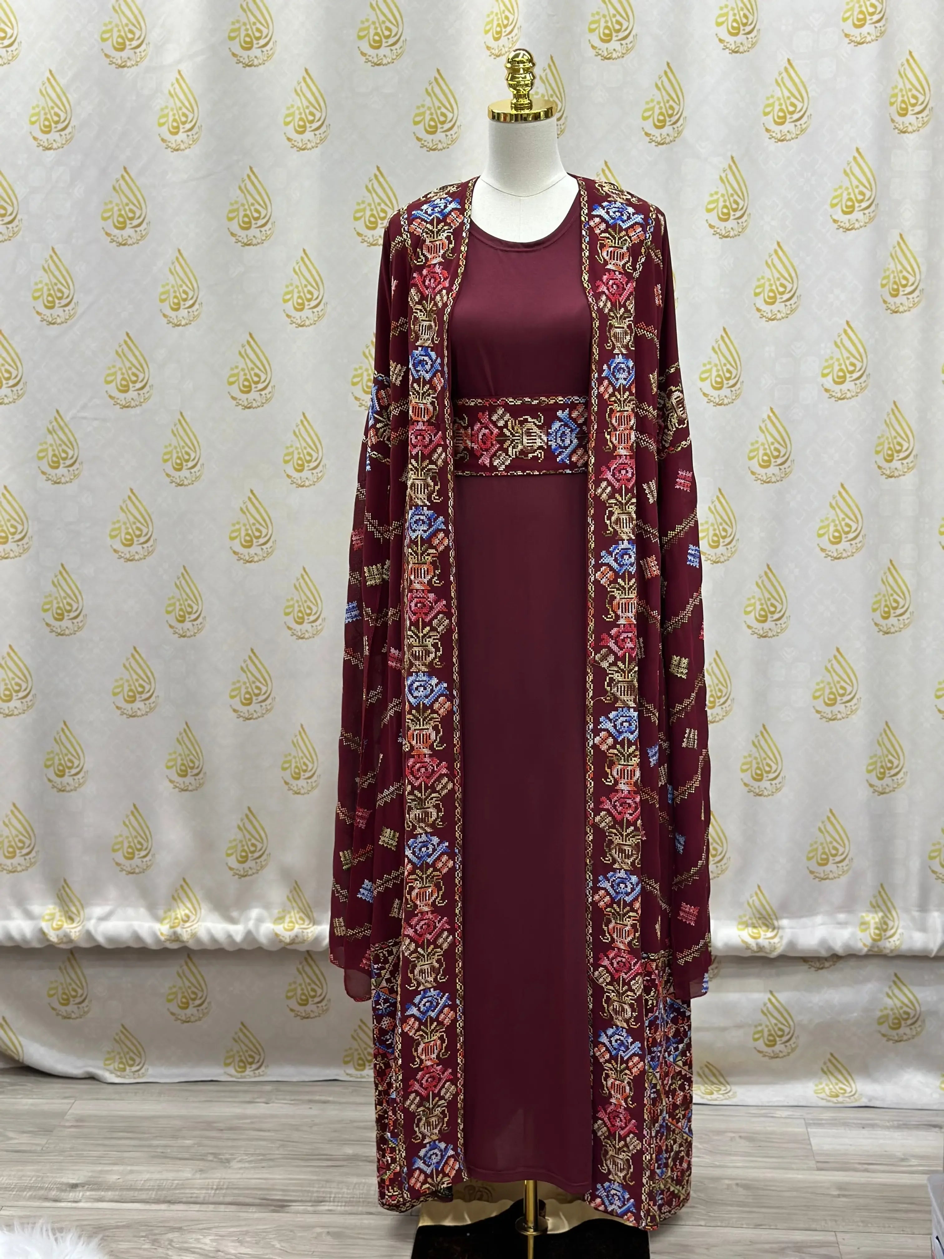 Luxury embroidered abaya kaftan in deep maroon with intricate floral embroidery by Palestinian Elegance