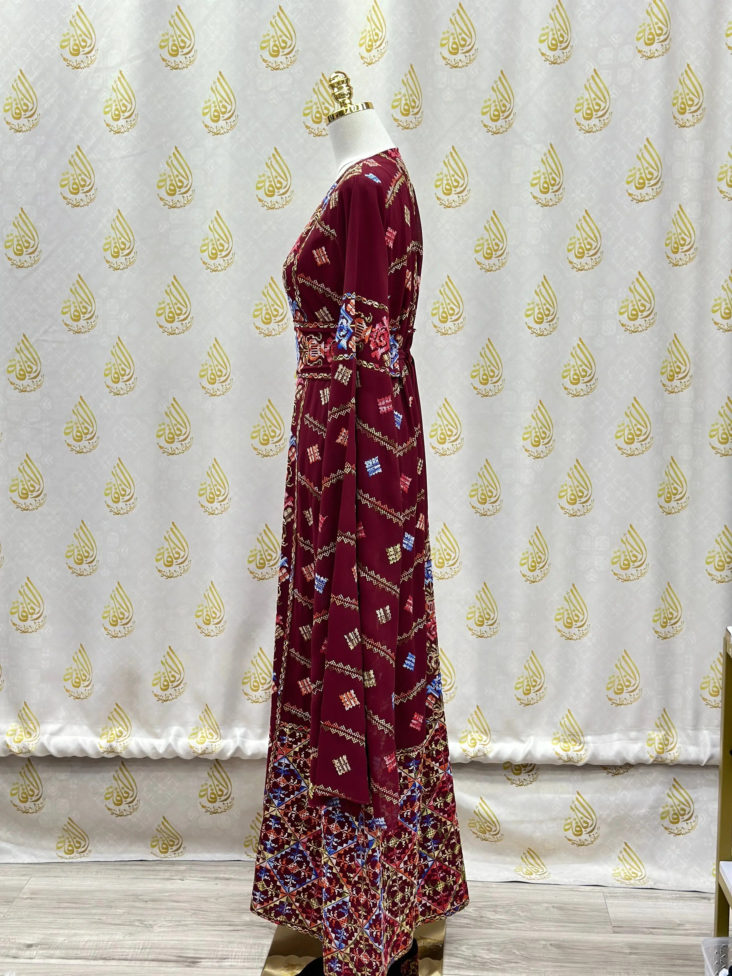 Palestinian Elegance luxury embroidered abaya in rich maroon with intricate colorful embroidery and flowing kaftan style