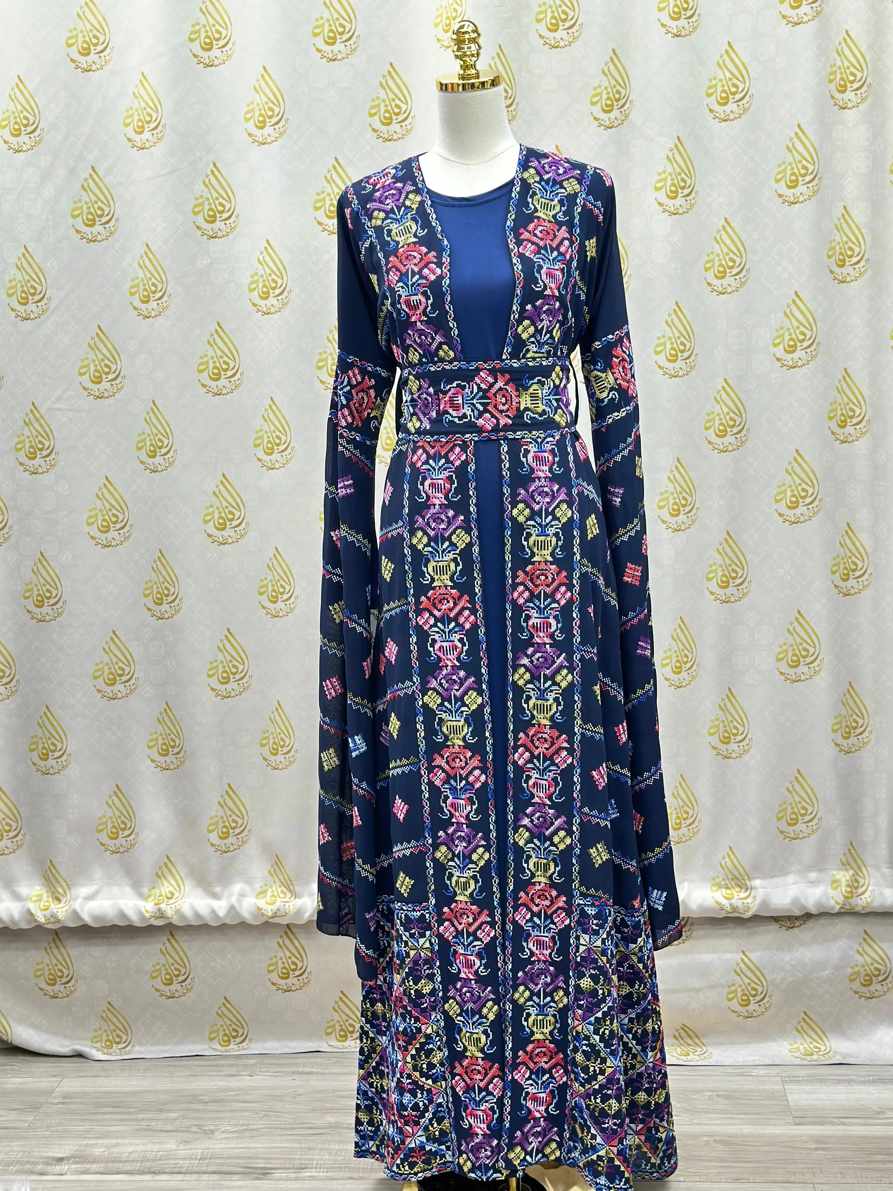 Palestinian Elegance navy kaftan featuring a luxury embroidered abaya design with colorful floral patterns