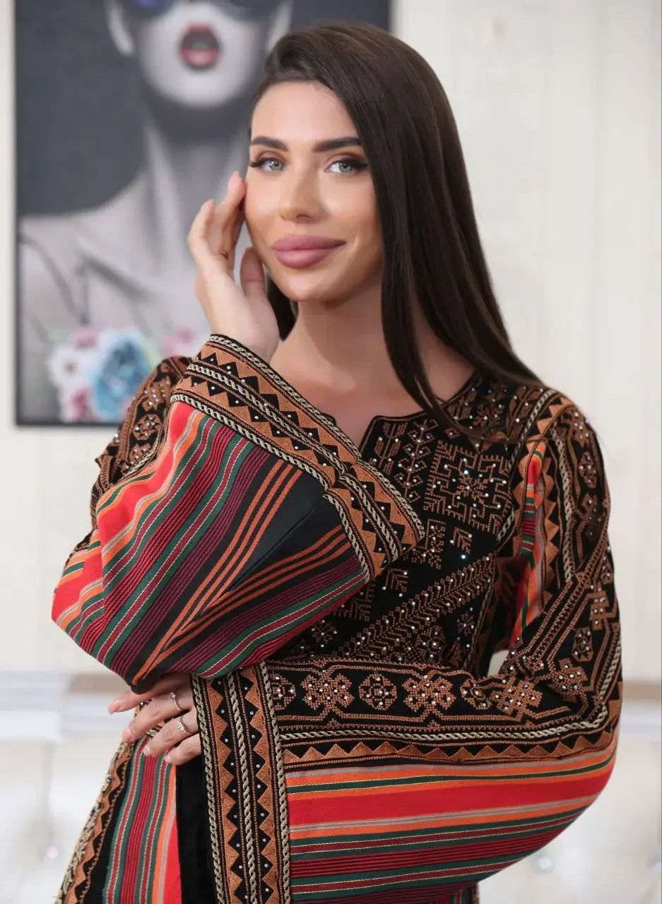 Woman wearing Brown Majdalwi Embroidered Dress with intricate traditional Palestinian embroidery
