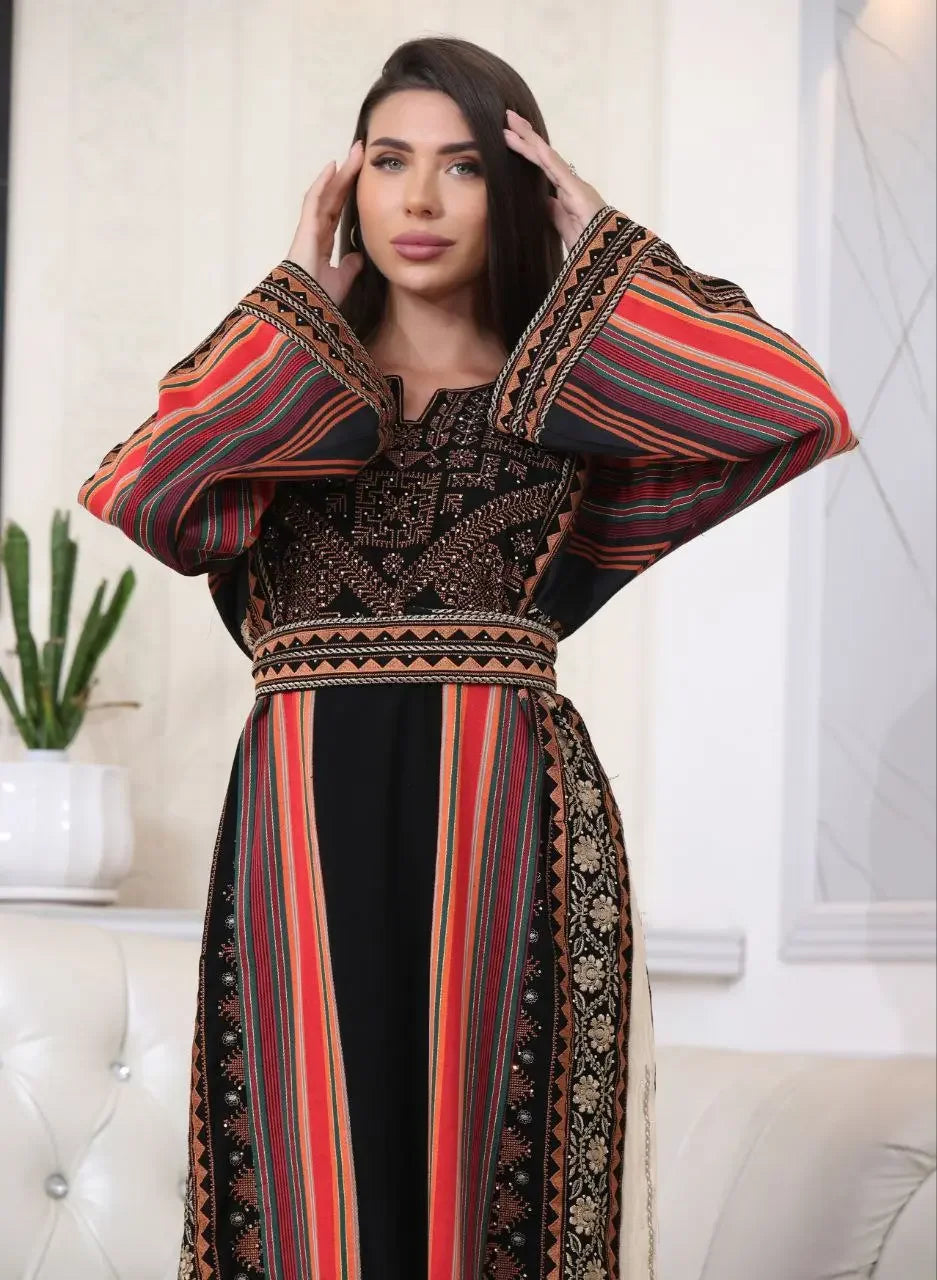 Brown Majdalwi Embroidered Dress by Palestinian Elegance featuring traditional intricate embroidery and colorful striped sleeves